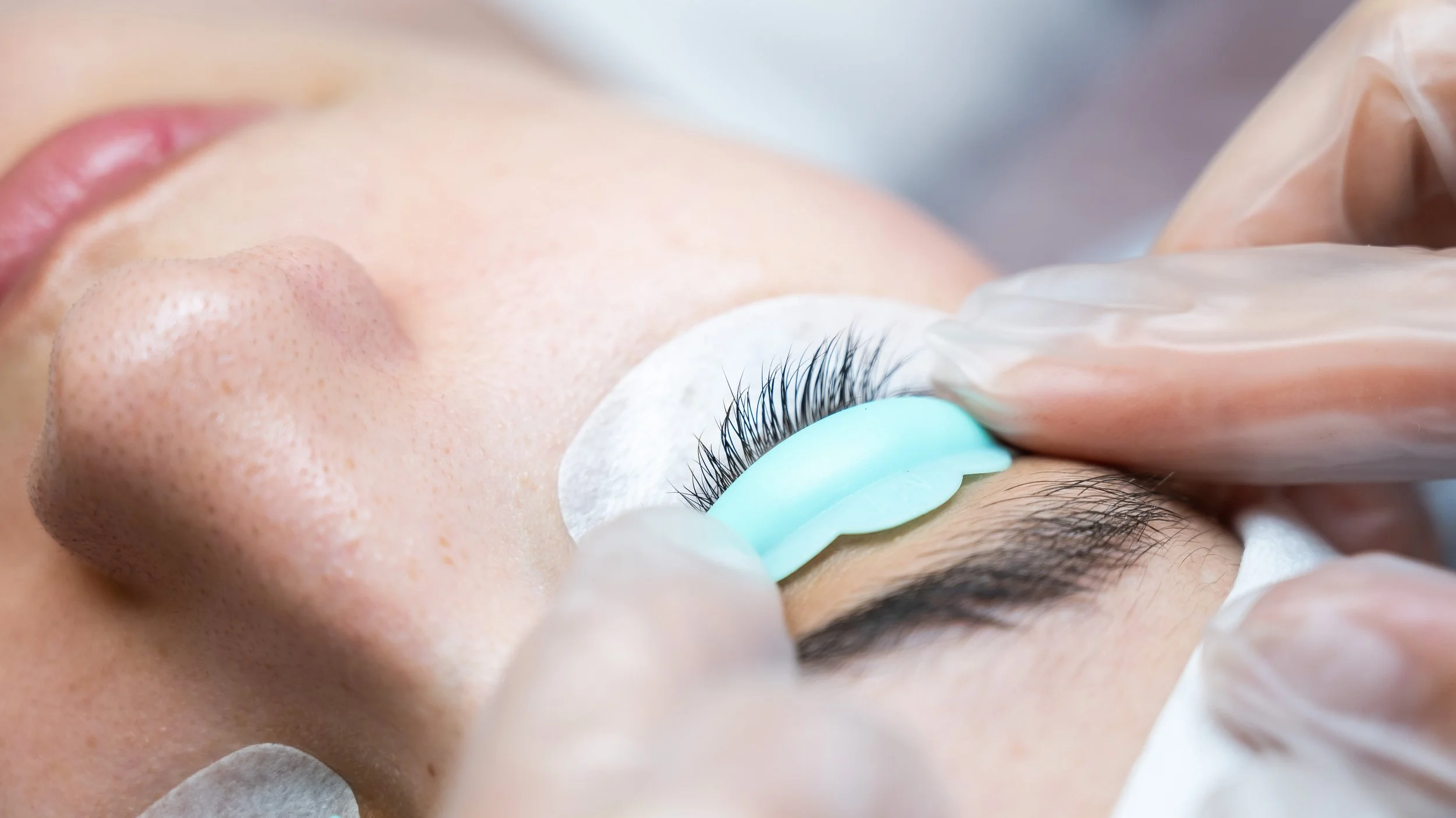 Eyelash lift treatment in progress with silicone pad