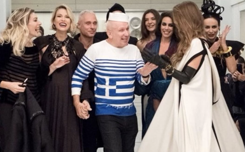 Group of people posing together at fashion event