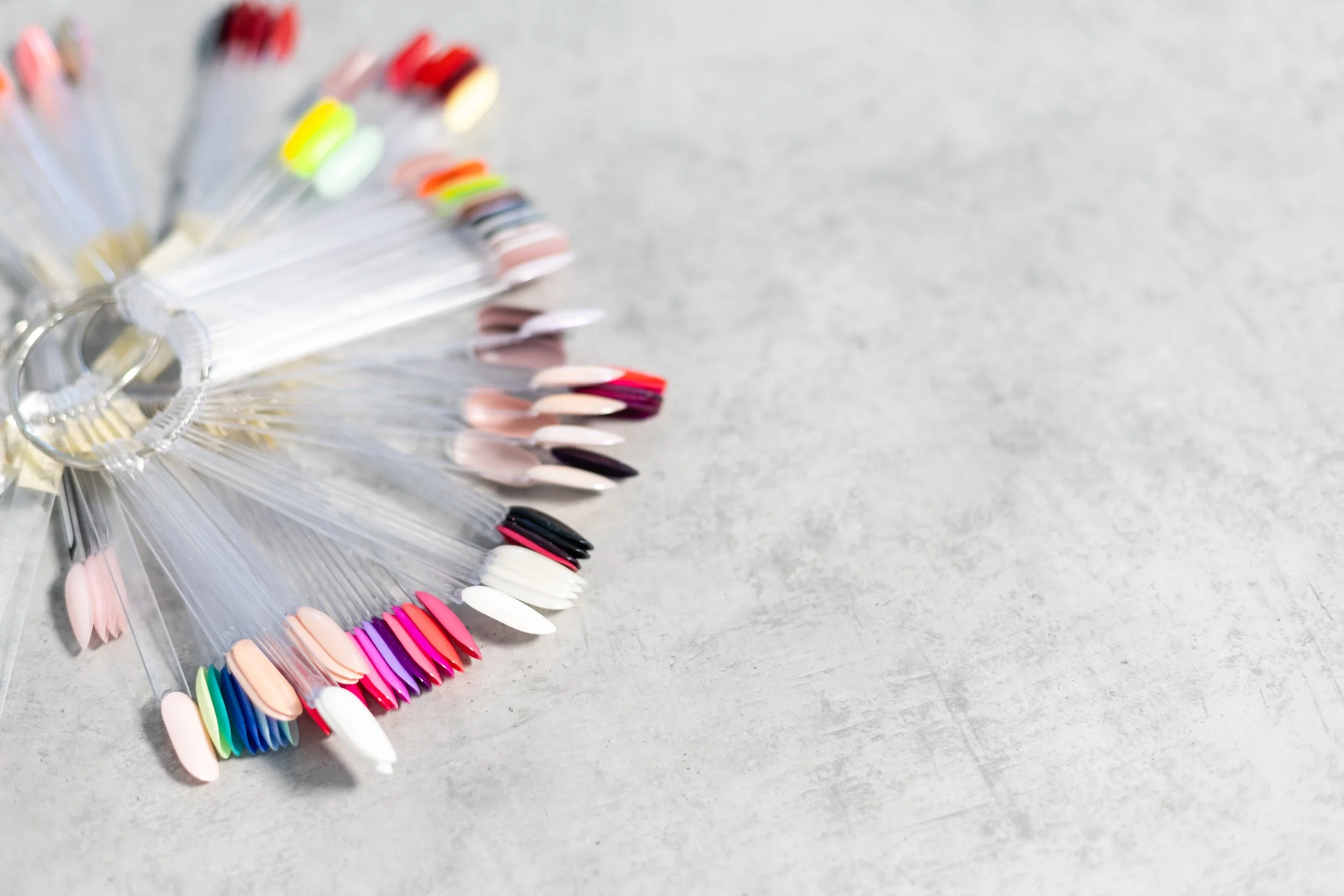 Nail colour swatches arranged on sample sticks