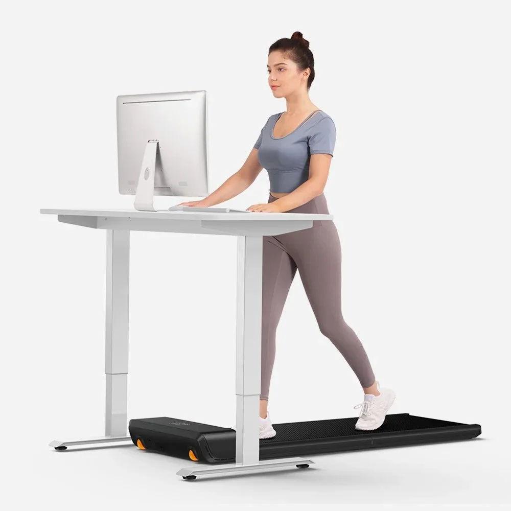 woman excersising on walking pad while working