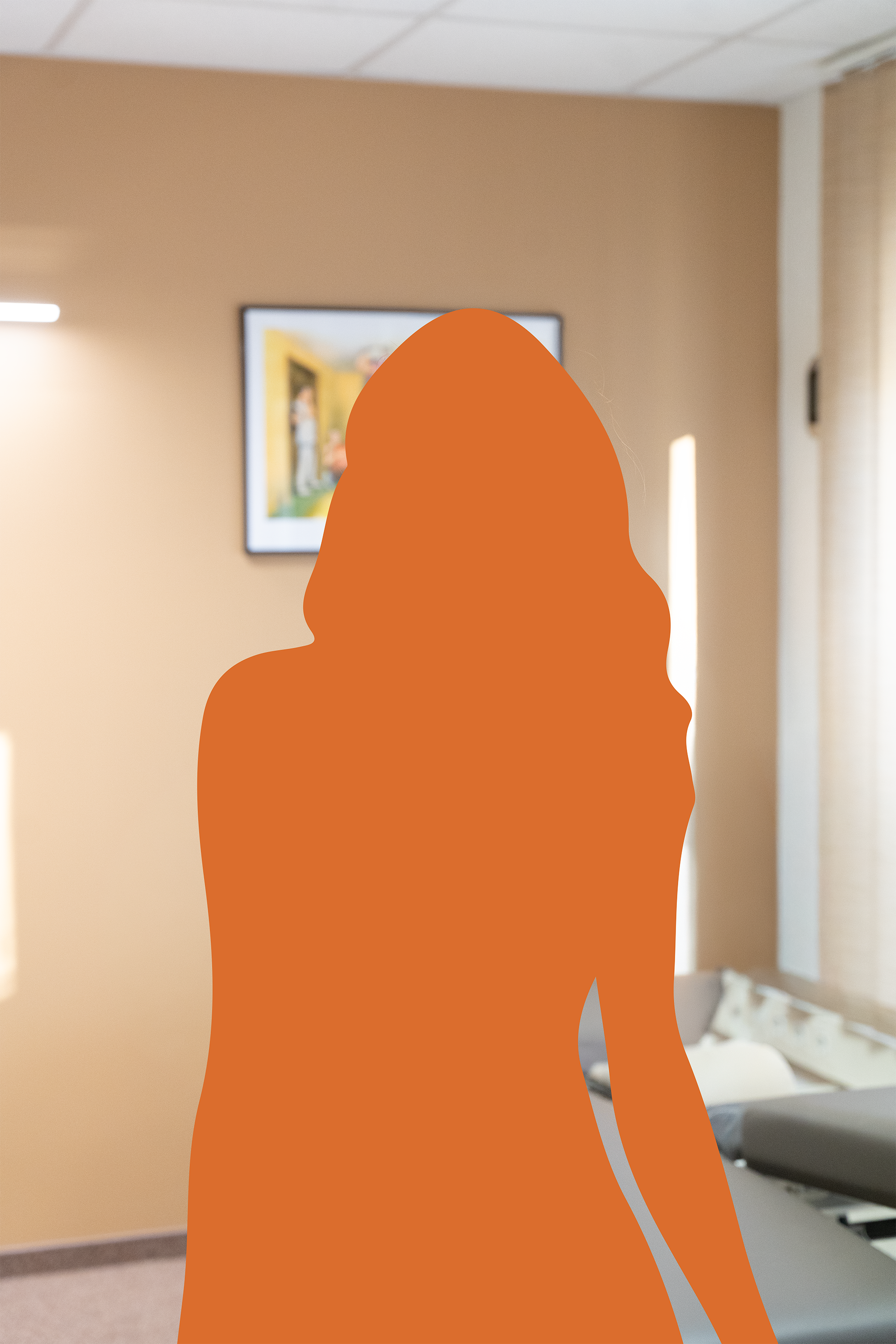A silhouette of a woman with long hair standing in a room with a beige wall, a window, and a framed picture, with a piano in the background.