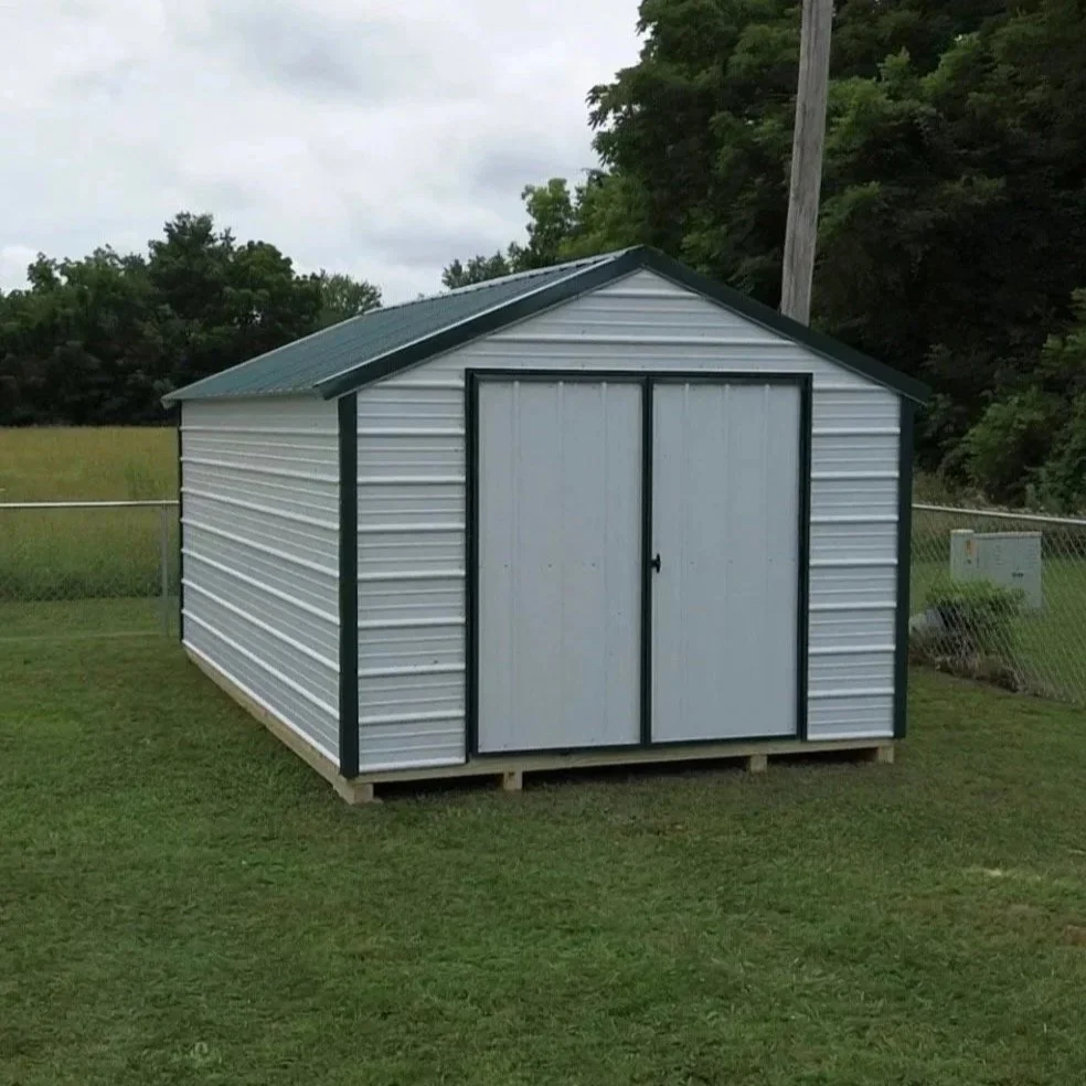 Small metal storage shed with a gable roof. Economic Utility Shed in Bolivar, Missouri.  Built by Premium Structures LLC.