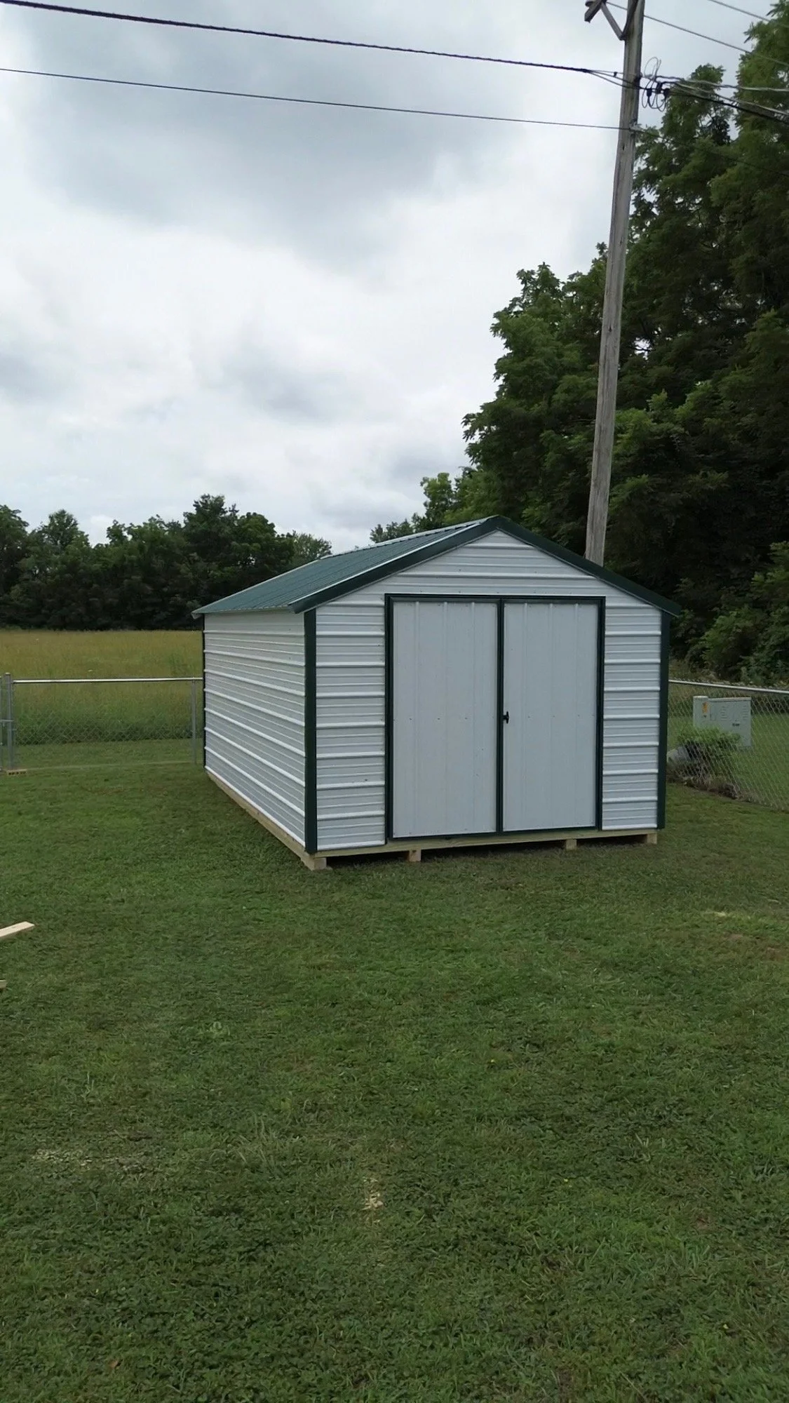 Portable 10x16 shed prebuilt at shop and assembled on-site in Bolivar, Missouri