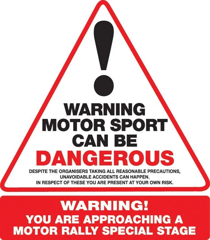 Triangle warning sign with an exclamation mark, warning that motor sport can be dangerous and that a motor rally special stage is approaching.