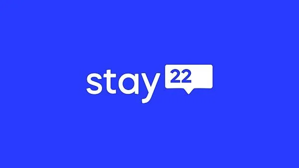 Blue background with white text that reads "stay 22" with a speech bubble around the number 22.