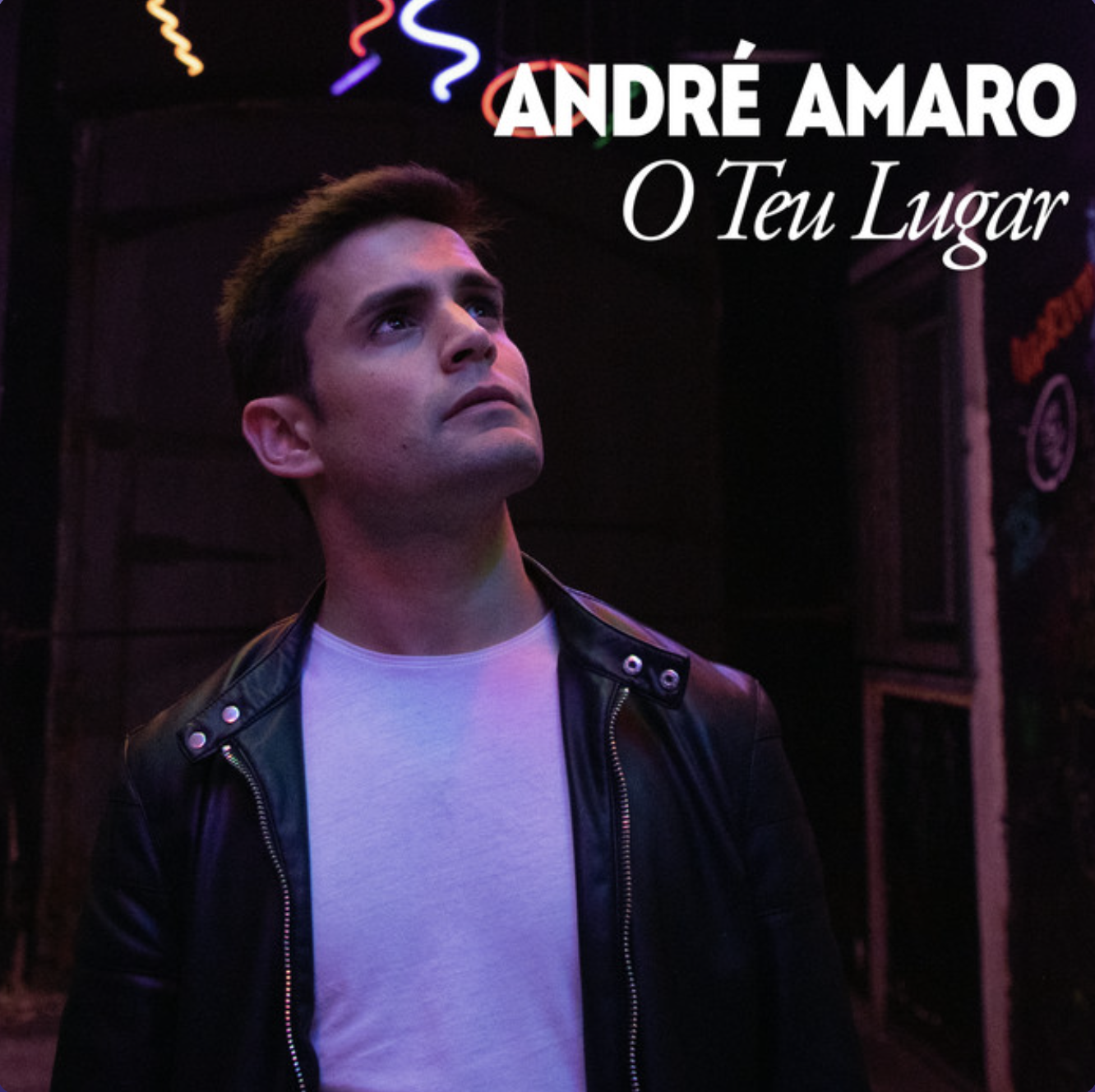 Album cover featuring a young man with dark hair, wearing a black leather jacket and white t-shirt, looking upwards against a dark background with colorful neon lights, with text 'ANDRÉ AMARO' and 'O Teu Lugar'.