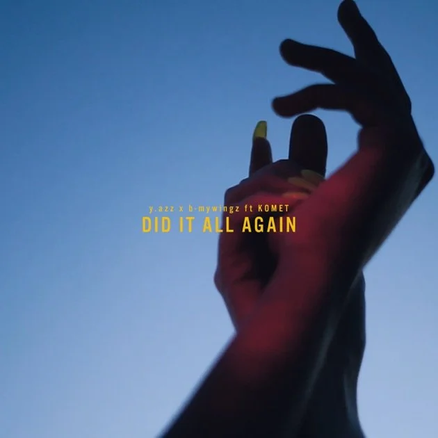 Silhouette of a hand with yellow-painted nails against a blue sky, with text overlay that says "Did It All Again" and mentions artists Y.Azz, B-Mywggz, and Komet.
