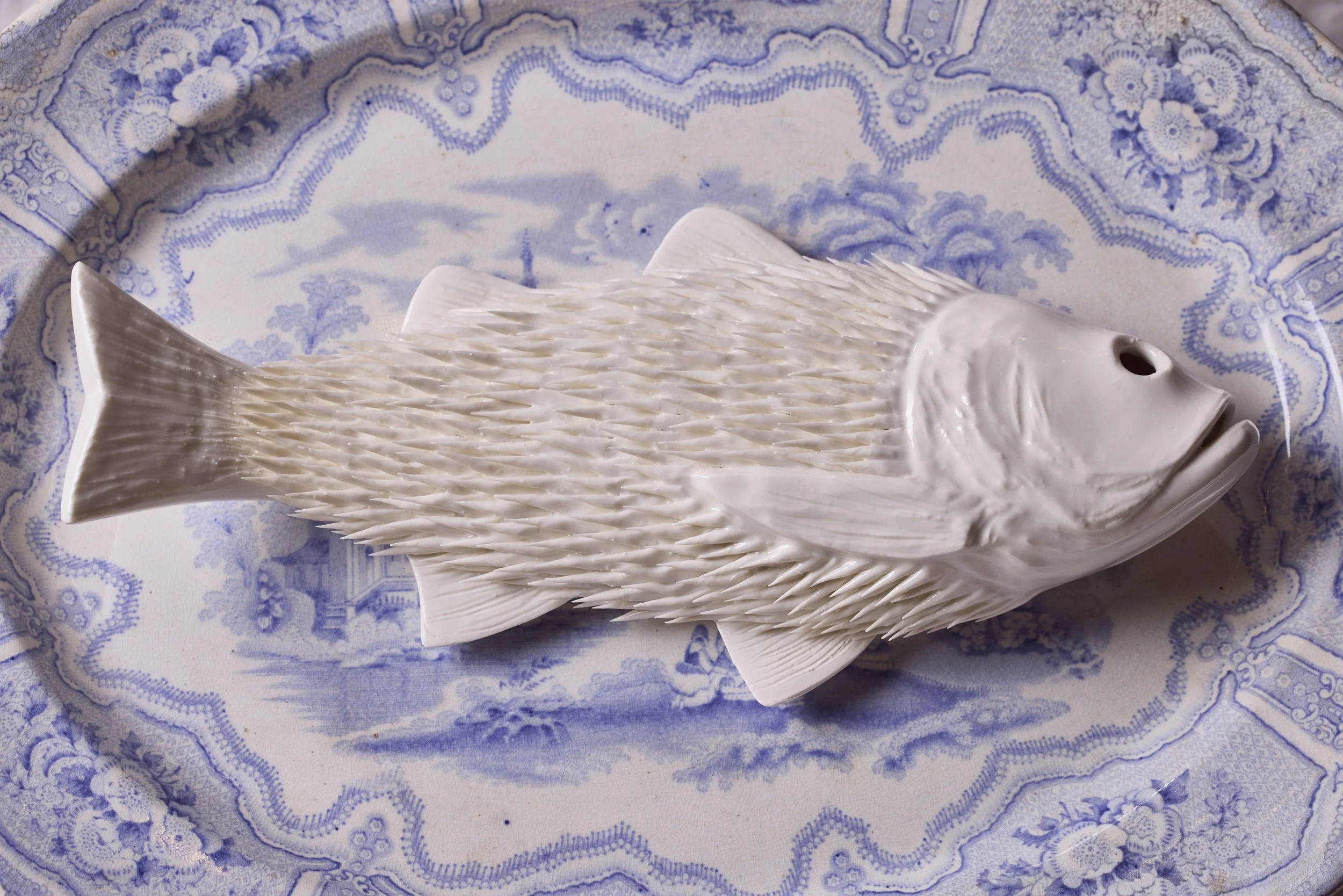 Detail of Ikuko Iwamoto' porcelain work. I ate lots of plastics, and now I am your dinner. Enjoy! QEST