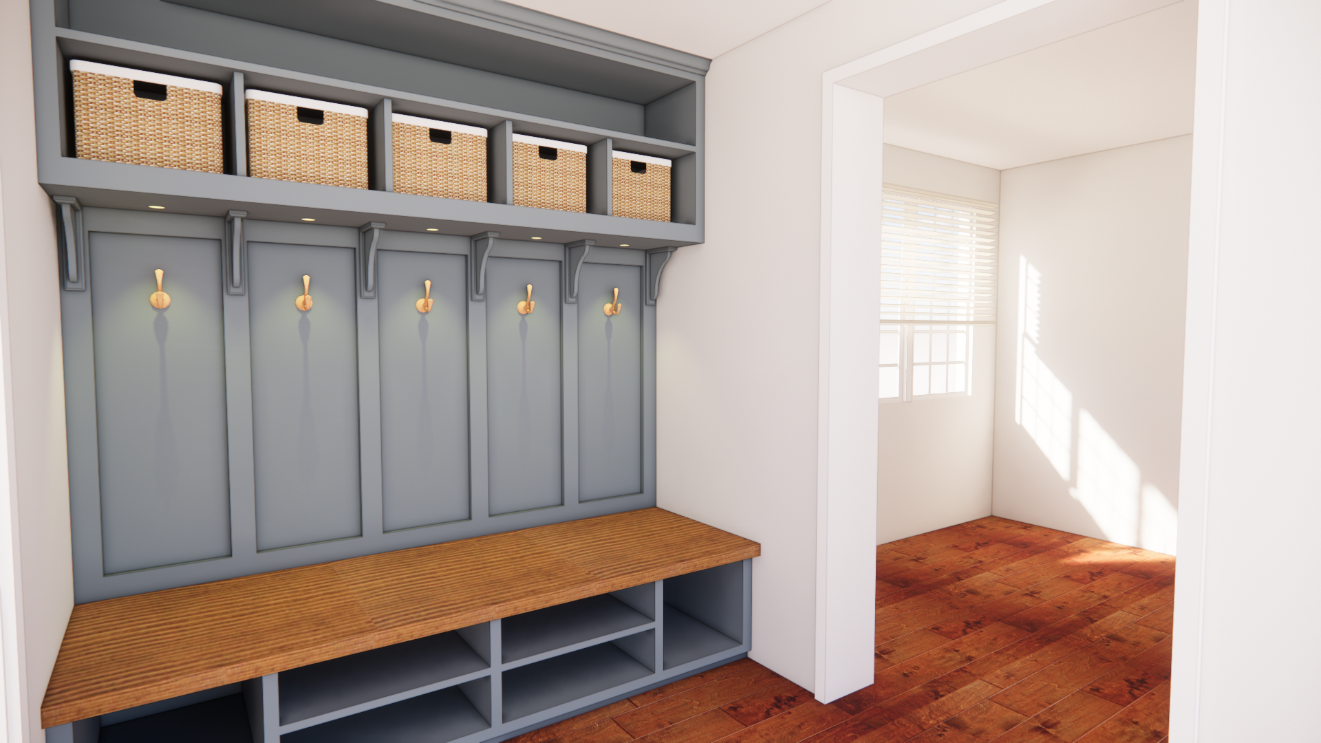 Mudroom with gray built-in shelves, hooks, and cubbies, a wooden bench, and storage baskets above, sunlight streaming in from a window.