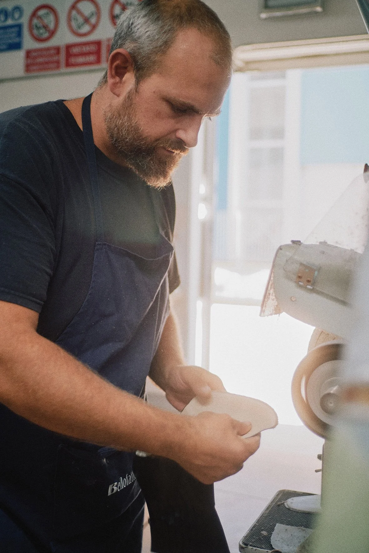 craftsman working on handmade shoe production