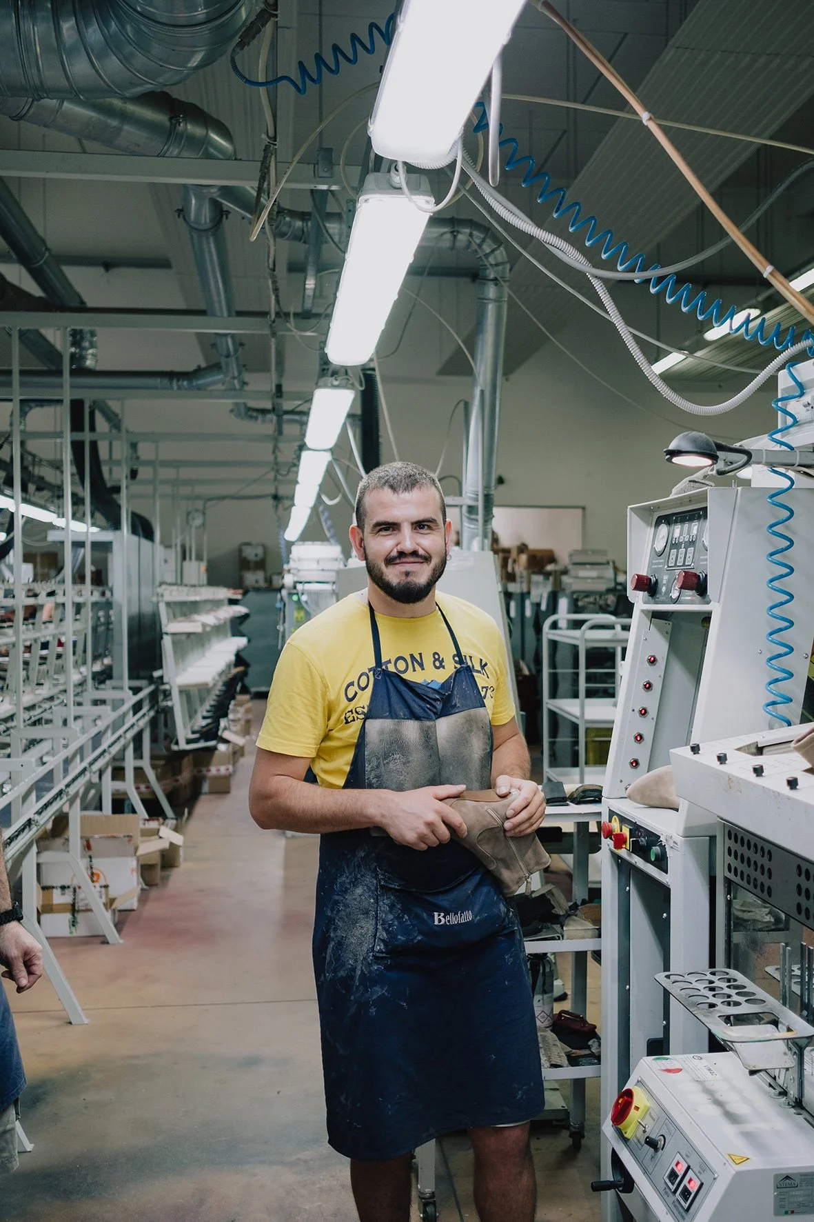 worker assembling shoes in  european factory