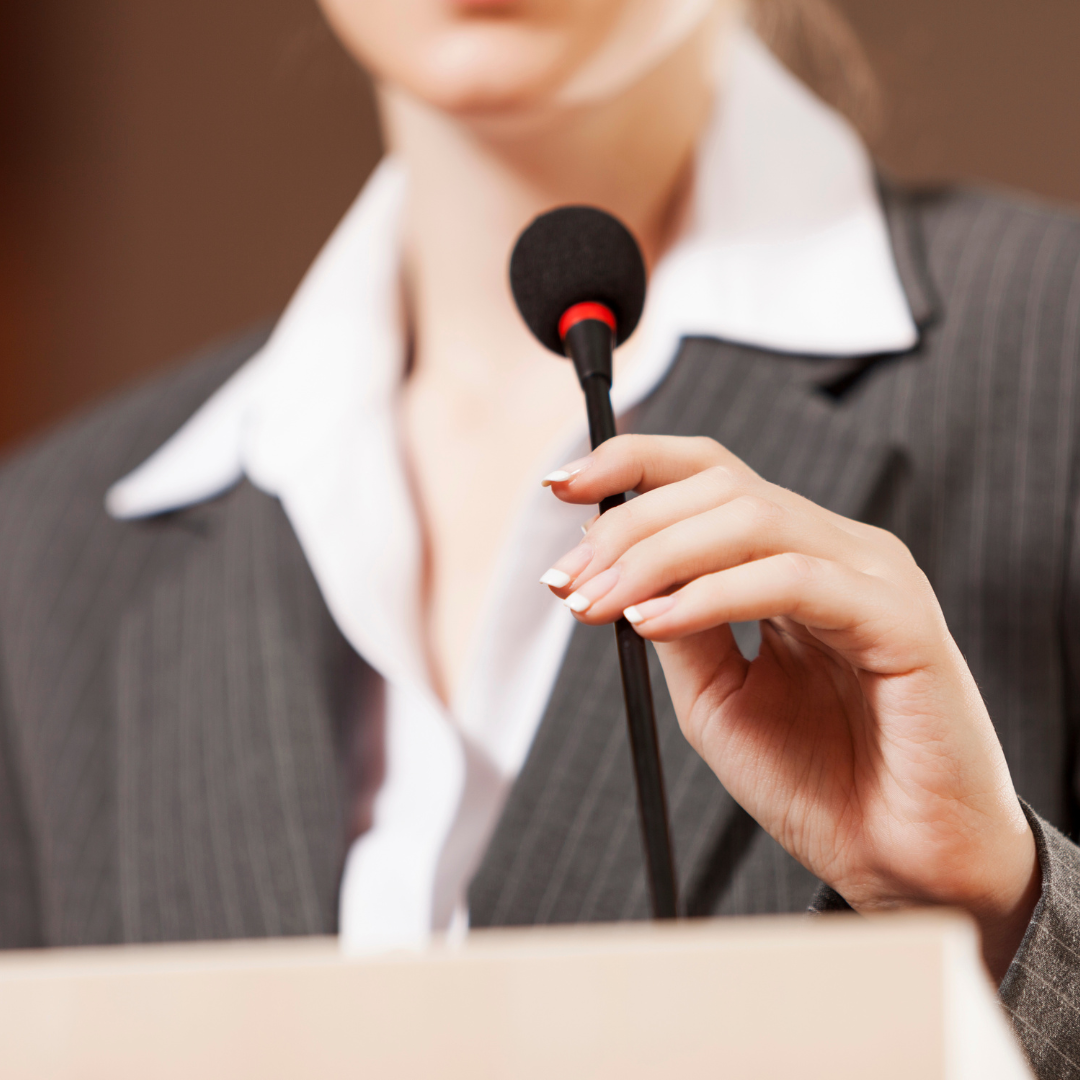 Why most event marketing feels the same (and how to stand out) | Presenter touching microphone | Event Momentum