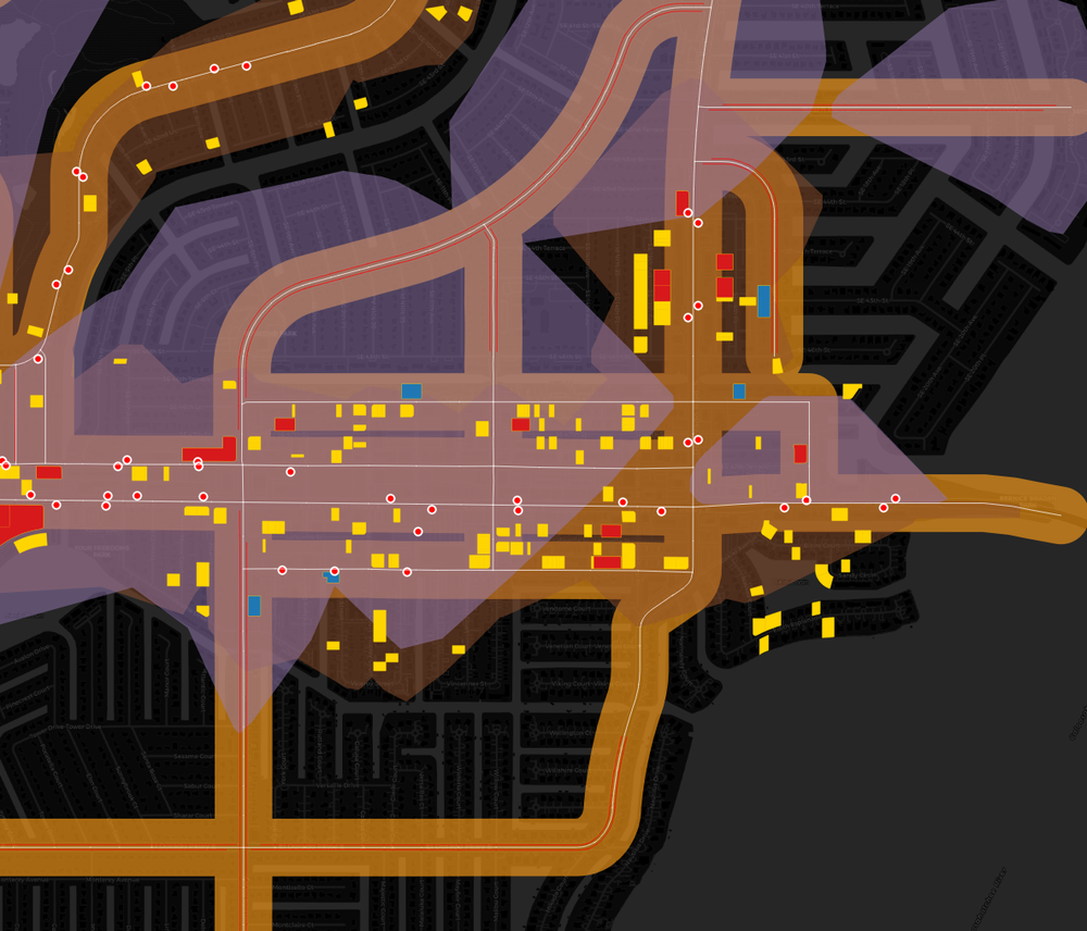 Map showing streets, buildings, and various locations with color coding, overlays, and markers, indicating a detailed urban area layout.