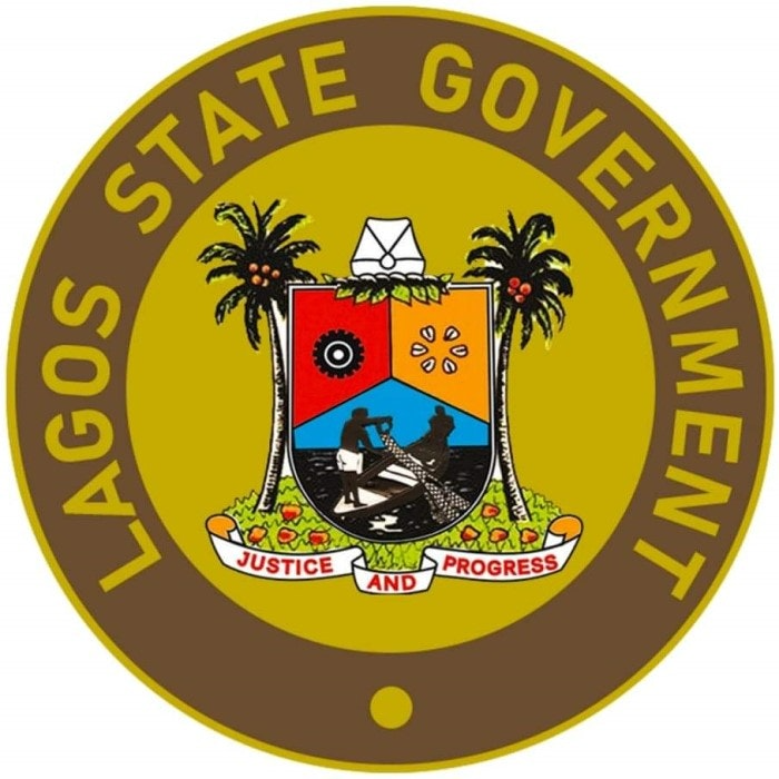 Seal of the Lagos State Government featuring a shield with palm trees, a ship, and two workers, surrounded by the words 'Lagos State Government' and a banner reading 'Justice and Progress'.