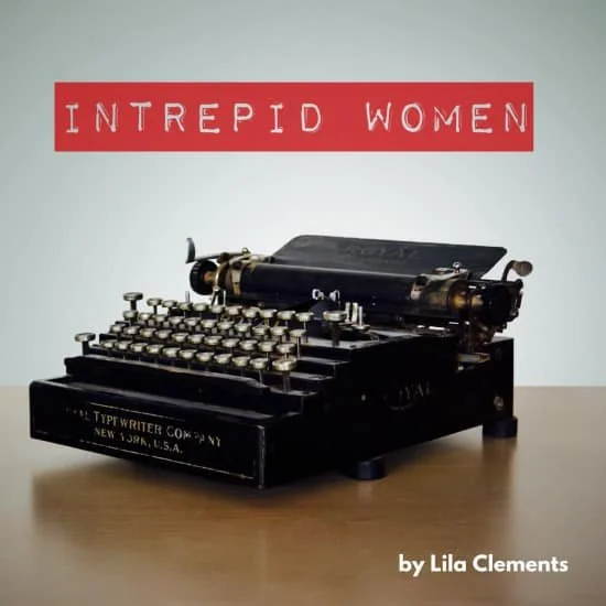 A vintage typewriter on a table with a sign that reads 'INTREPID WOMEN' in red text above it and 'by Lila Clements' below.