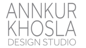 Text logo for Annkur Khosla Design Studio against black background.