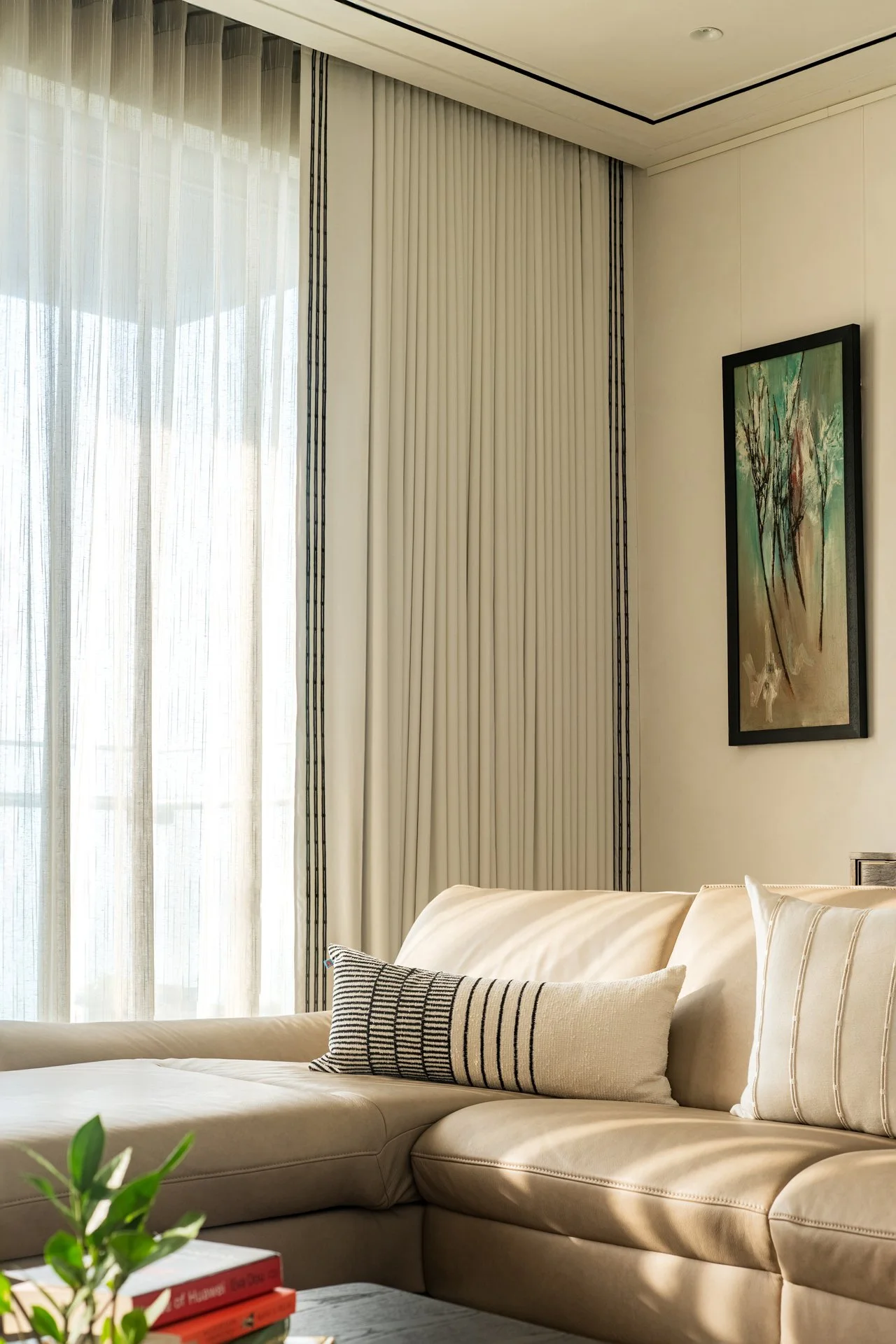 This is a residential home designed by Essajees Atelier at 360 West, Worli. Soft furnishings like Drapes, cushions and bedspreads designed by The Pink Champa