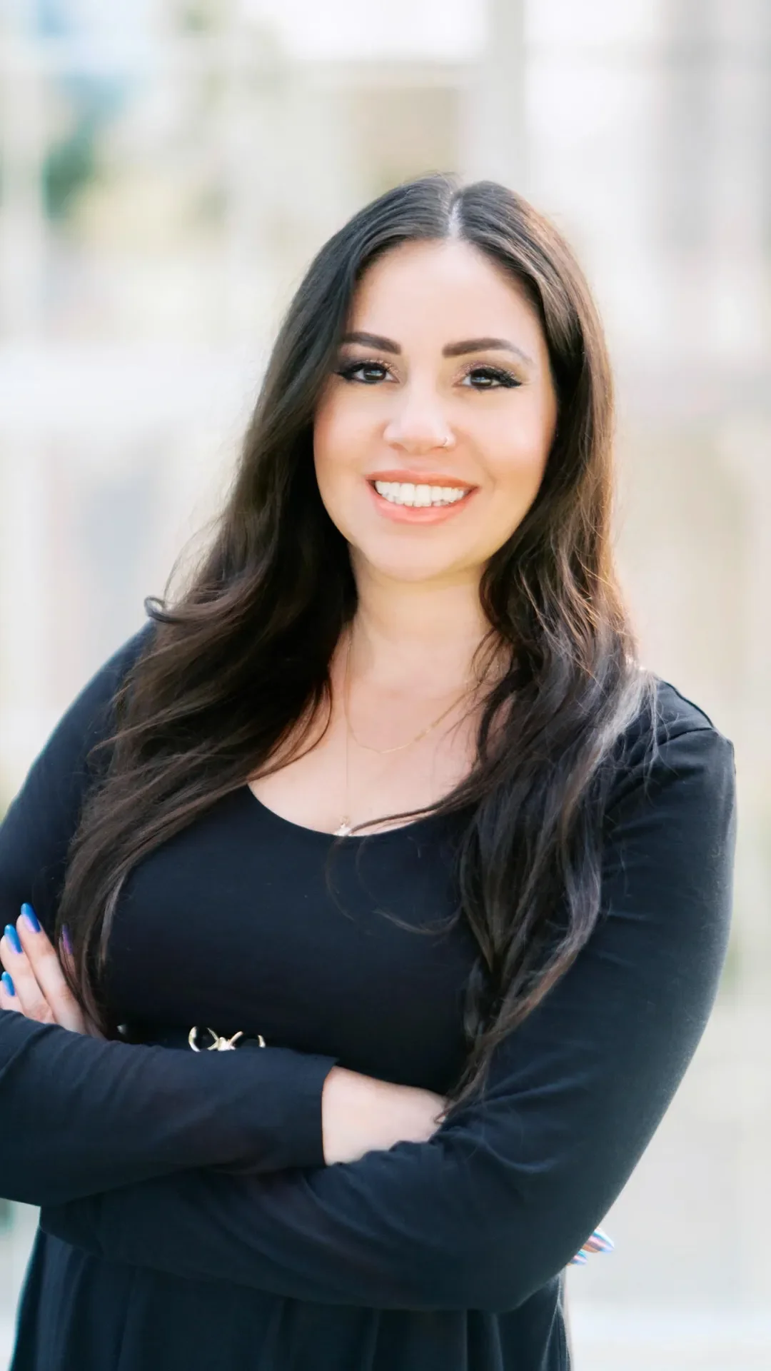 Woman standing, smiling