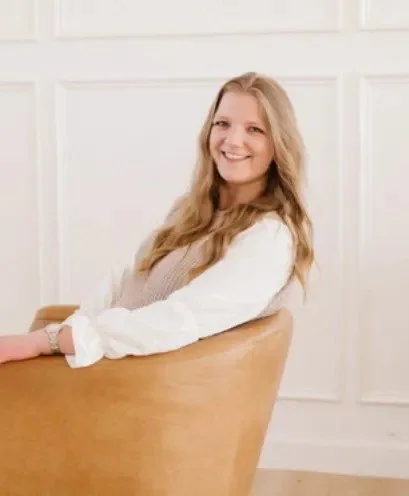 Woman in chair, smiling