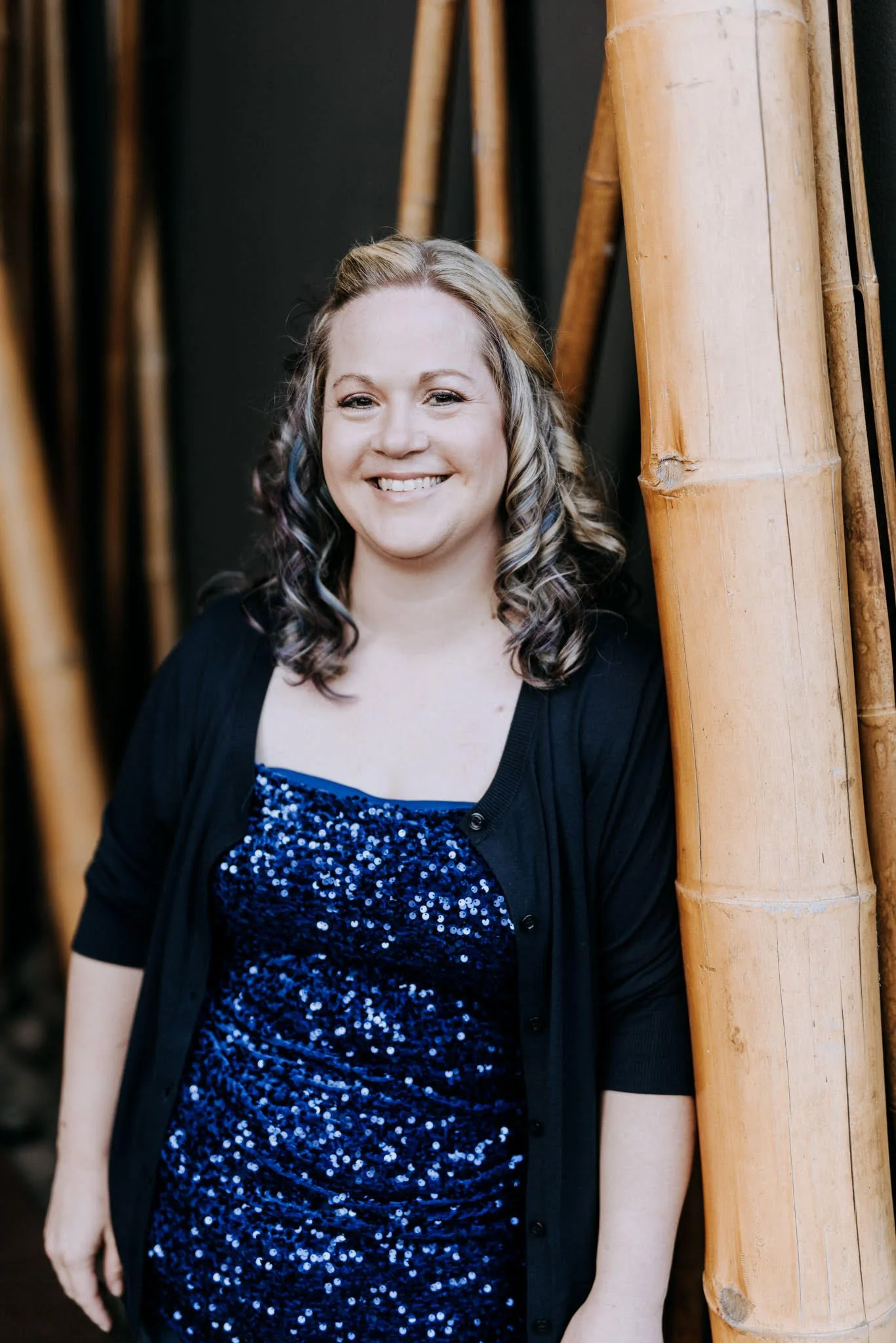 Woman standing, smiling