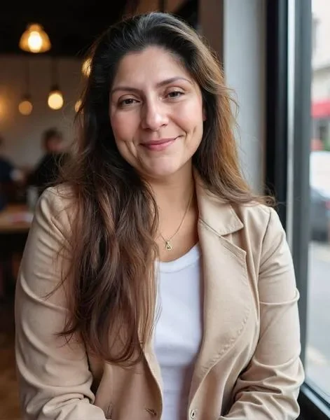 Woman seated with soft smile