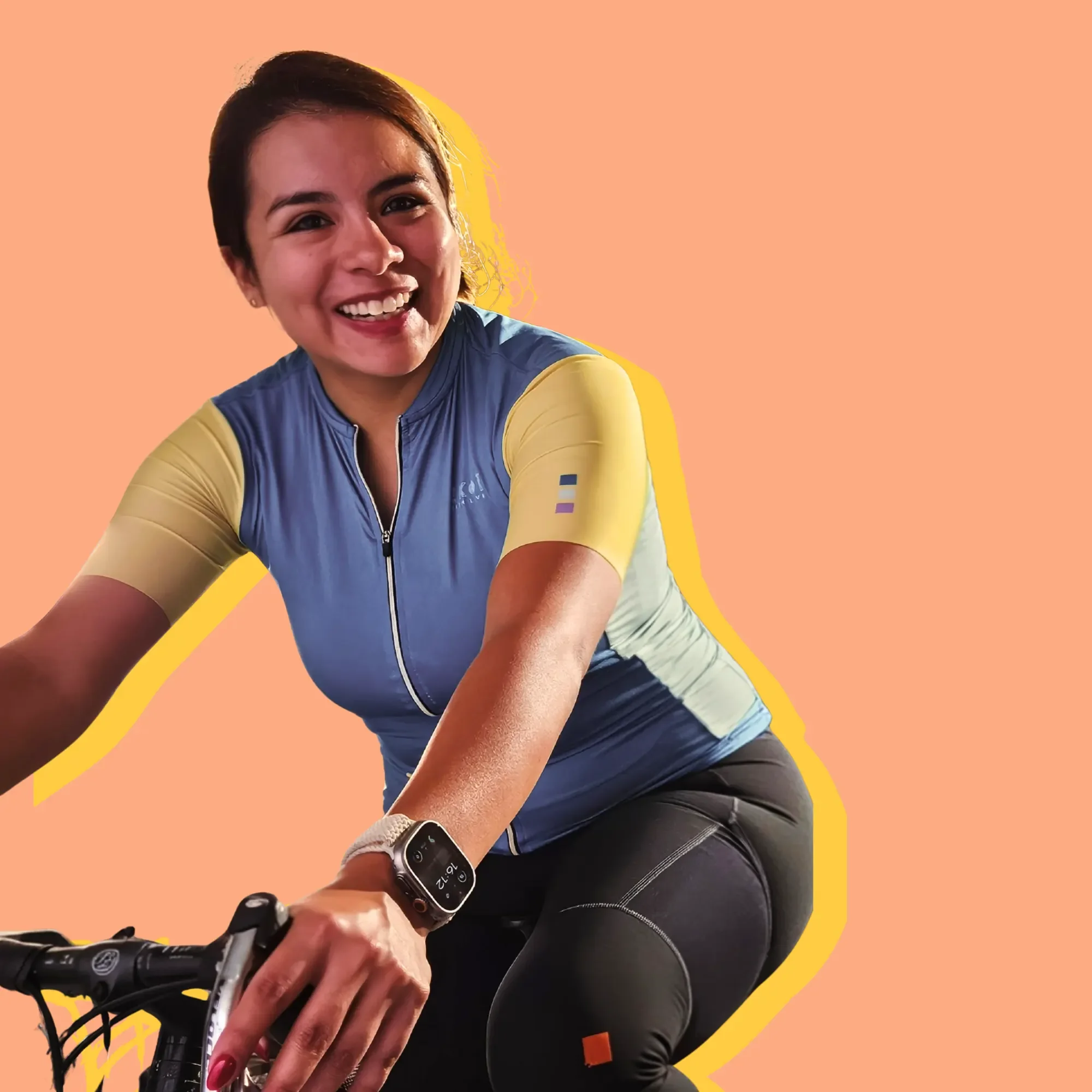 Woman on a bike, smiling, with an orange background