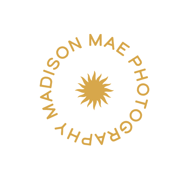 Gold text in a circular shape reading 'Madison Mae Photography' surrounding a stylized sun icon.