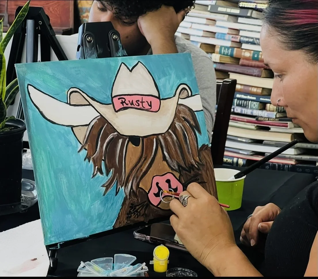 Turquoise Cow with painter.jpg