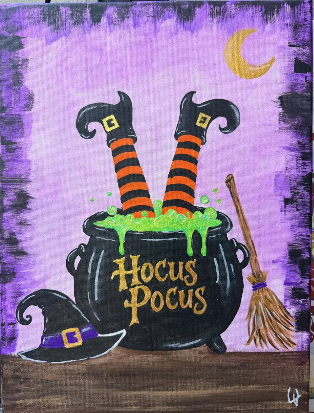 A Halloween-themed painting featuring a black cauldron labeled 'Hocus Pocus' with green bubbling potion overflowing. Two witch legs in striped orange and black stockings with pointed shoes stick out of the cauldron. A witch's hat with a purple band and a buckle rests on a wooden surface to the left, and a small broomstick leans against the cauldron on the right. The background is purple with a crescent moon in the upper right corner.