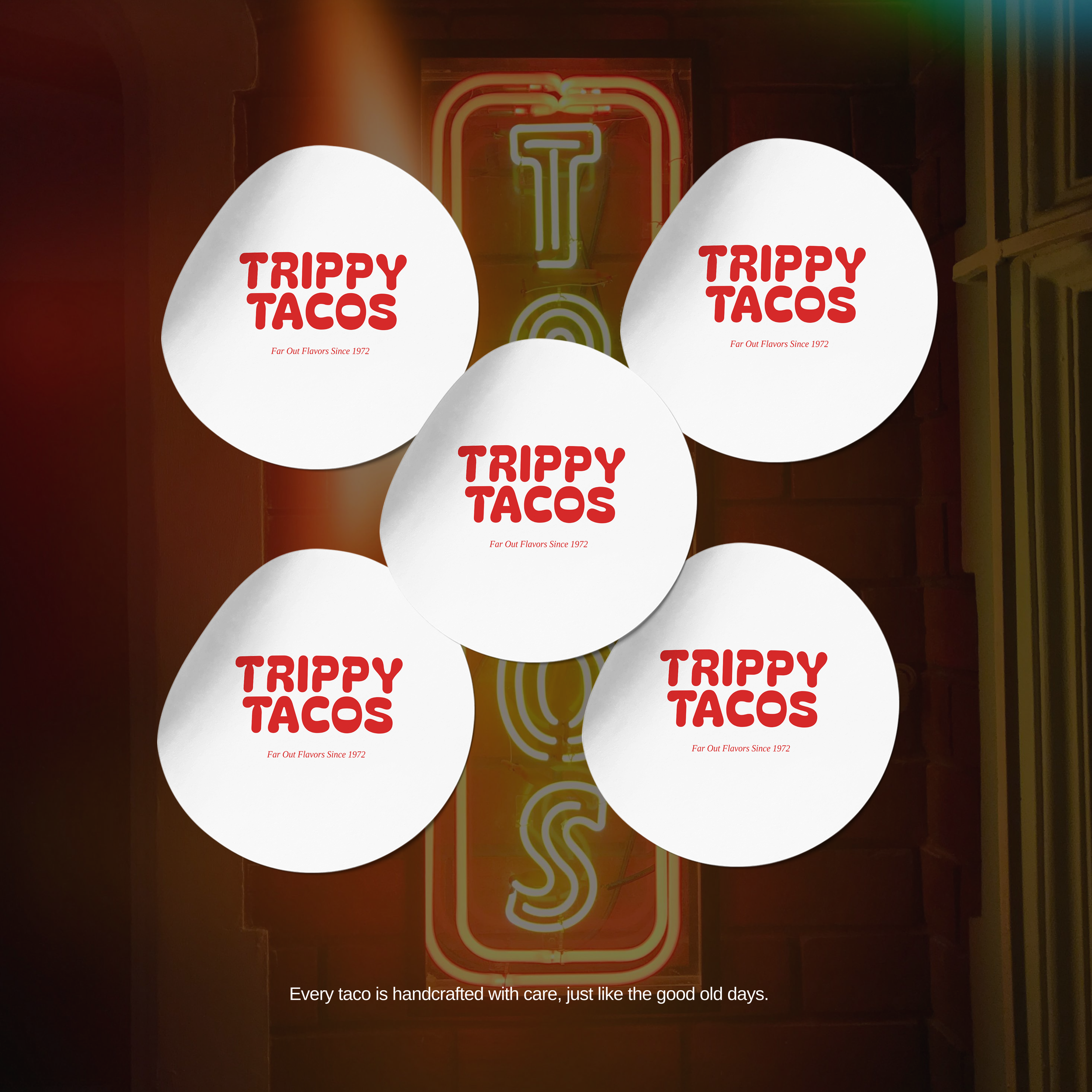 Five white paper taco wrappers with red text 'Trippy Tacos' and tagline 'Far Out Flavors Since 1972' arranged on a table with a neon sign in the background and a caption at the bottom reading 'Every taco is handcrafted with care, just like the good old days.'