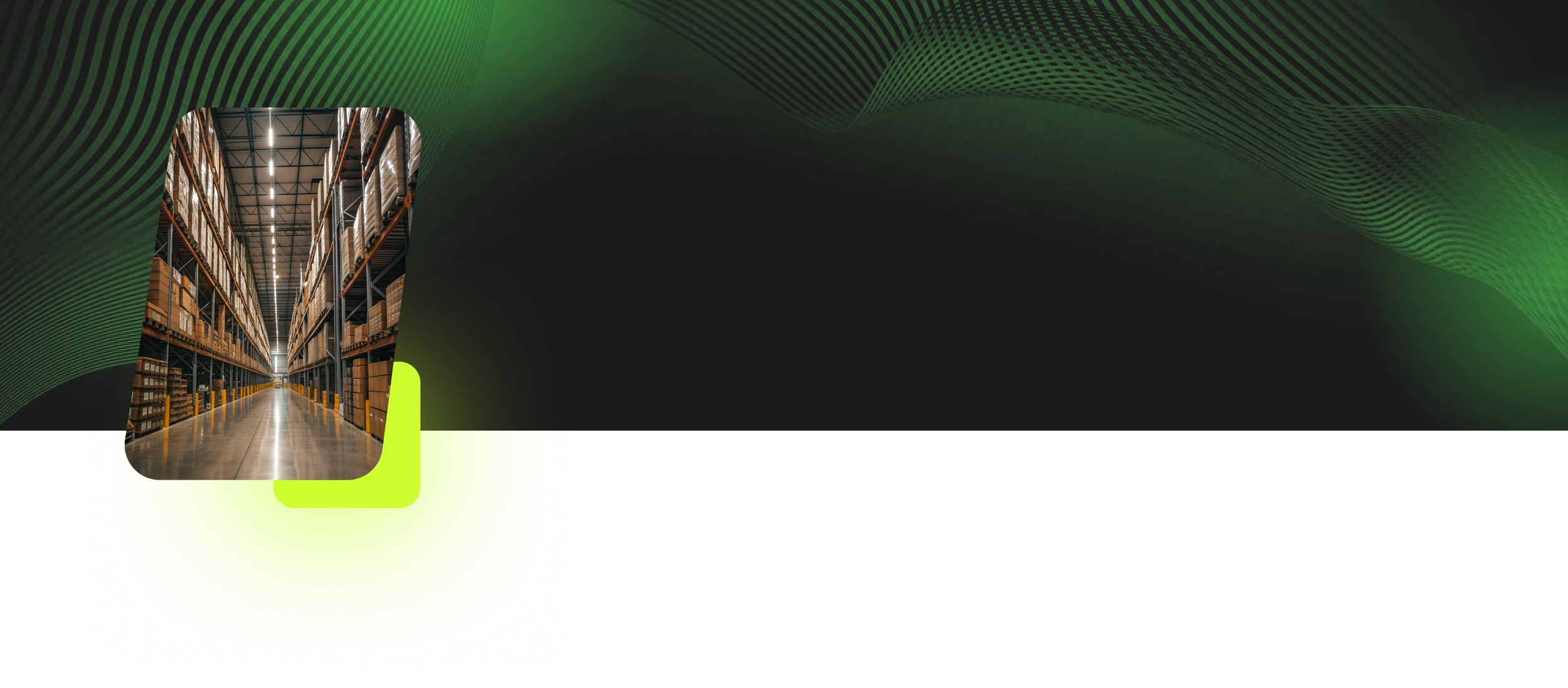 Warehouse aisle with shelves filled with boxes and pallets, viewed from the end of the aisle.