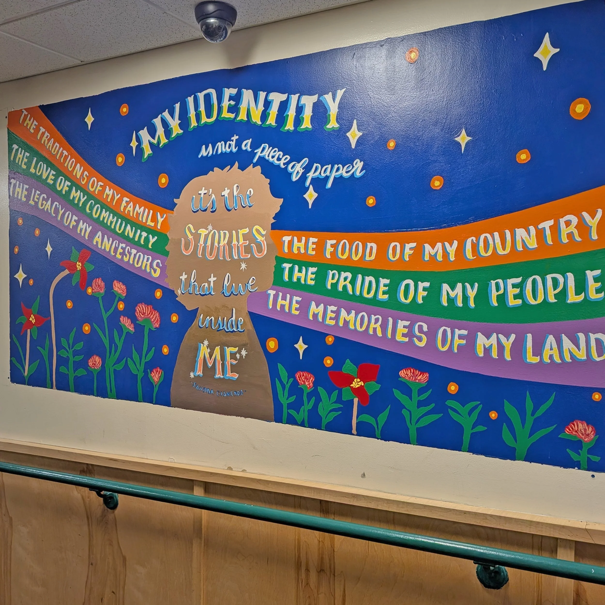 This mural, created with the Main Street Middle School BIPOC Connection Student Space, celebrates the many threads that shape our identities.

Inspired by a quote from Sandra Cisneros &mdash; &ldquo;My identity is not a piece of paper; it&rsquo;s the