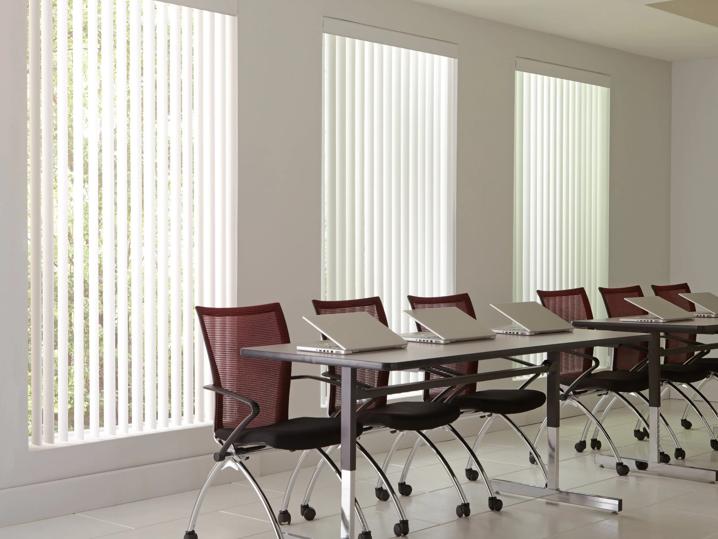 White vertical blinds, open in an office