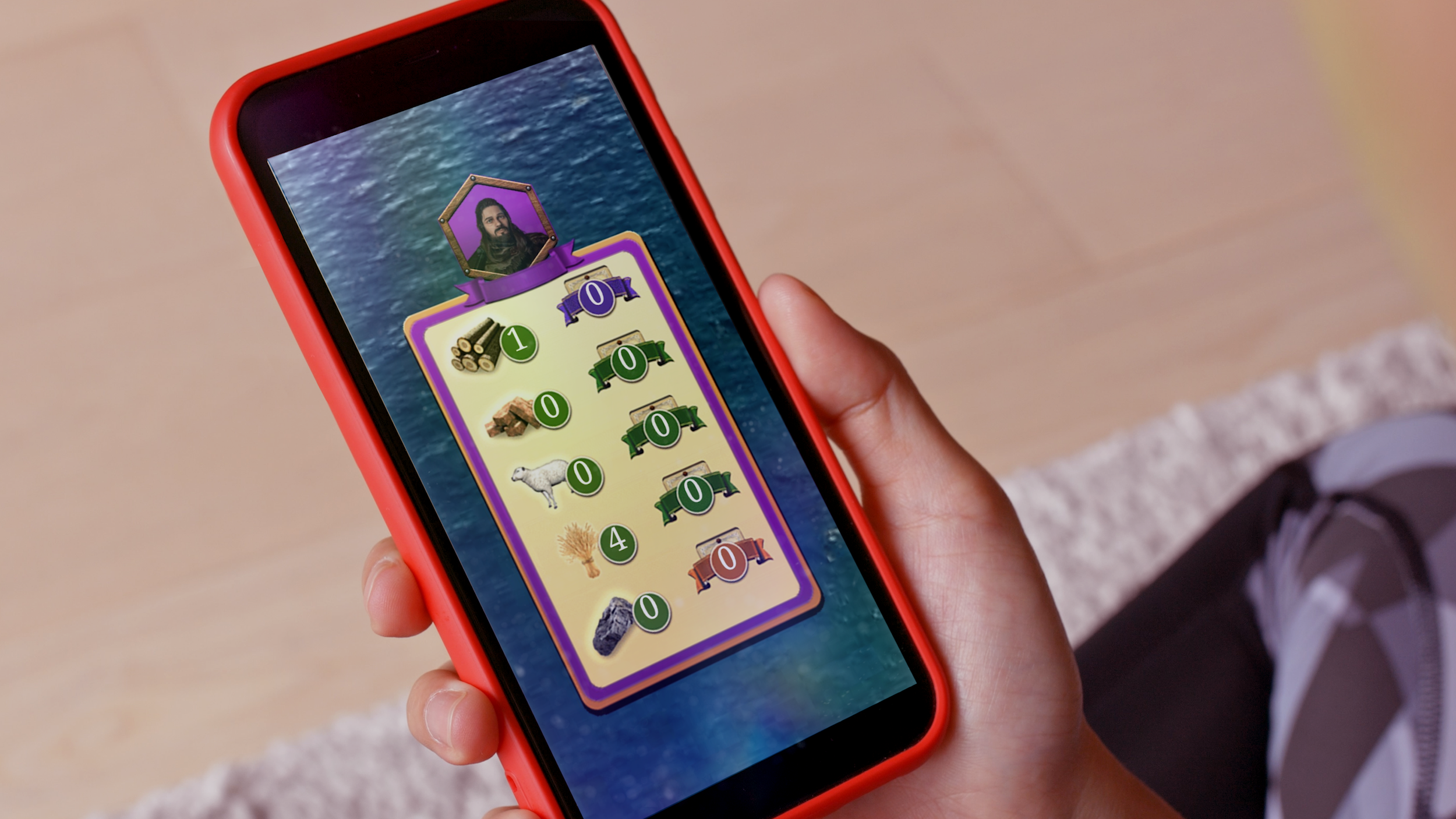 ダヴテールゲームズ_カタン-コンソールエディション_スマートフォンの画面にハッシュタグゲームの画面が表示されている。背景は海の画像。