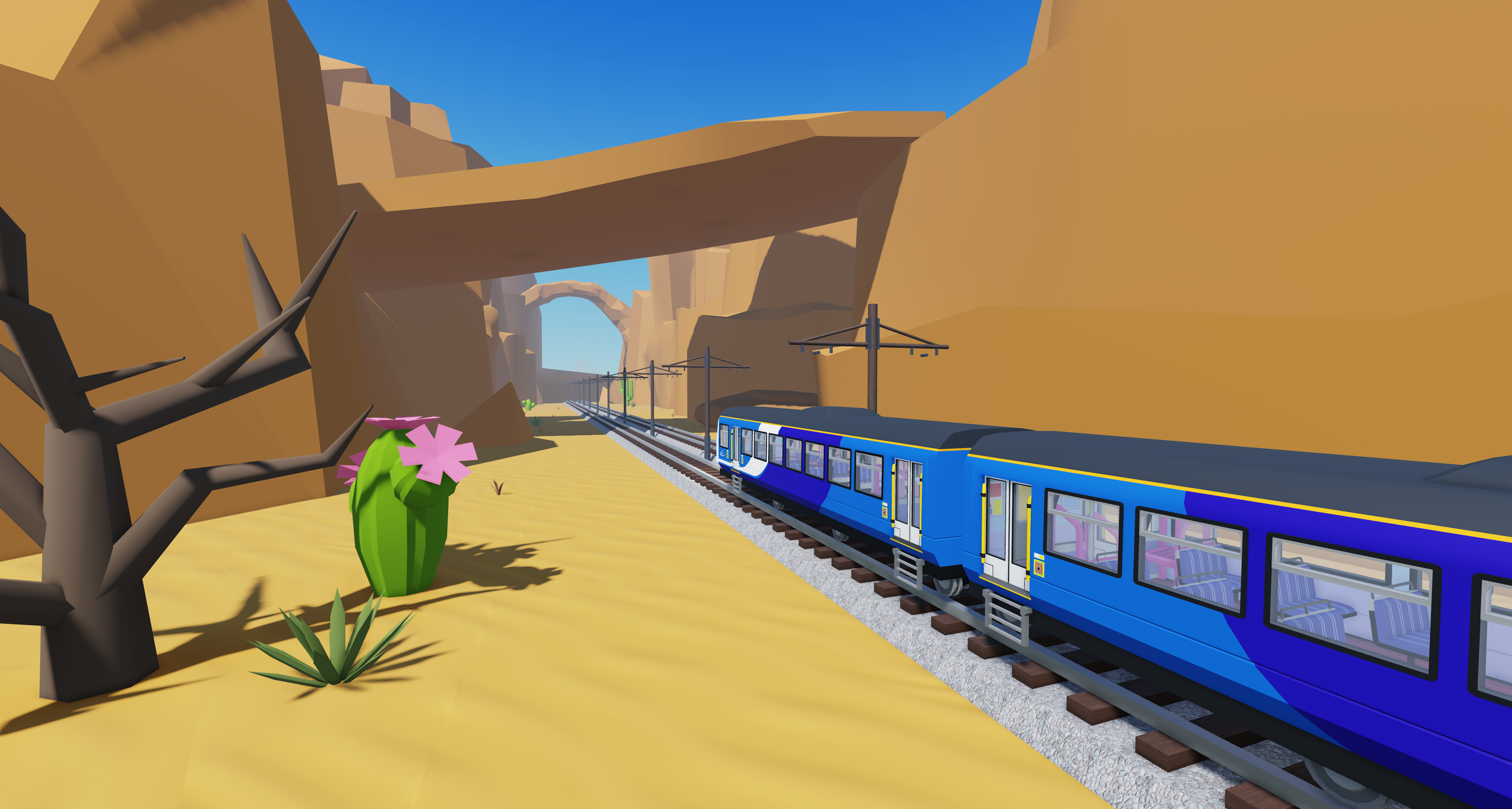 ダヴテールゲームズ_トレインシムワールドタイクーン_砂漠の風景と青い列車が走る風景。左側には枯れた木とピンク色のサボテンと緑の植物がある。遠くに岩山とアーチ状の岩の橋が見える。