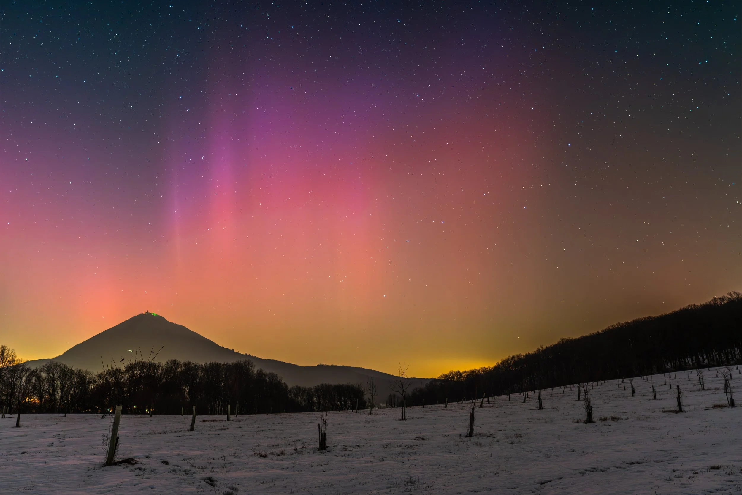 The Aurora over Mount Milešovka in the Bohemian Central Range