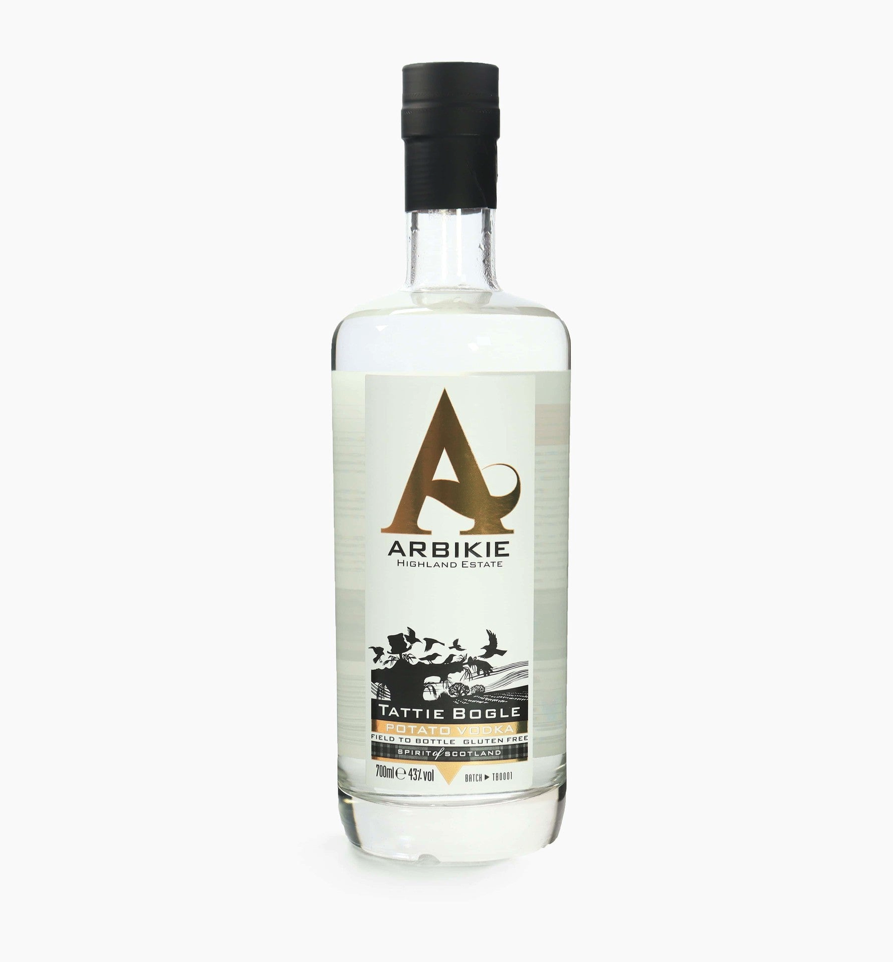 A clear glass bottle of Arbikie Highland Estate Tattie Bogle Potato Vodka, featuring a white label with black and gold accents, and a black cap.