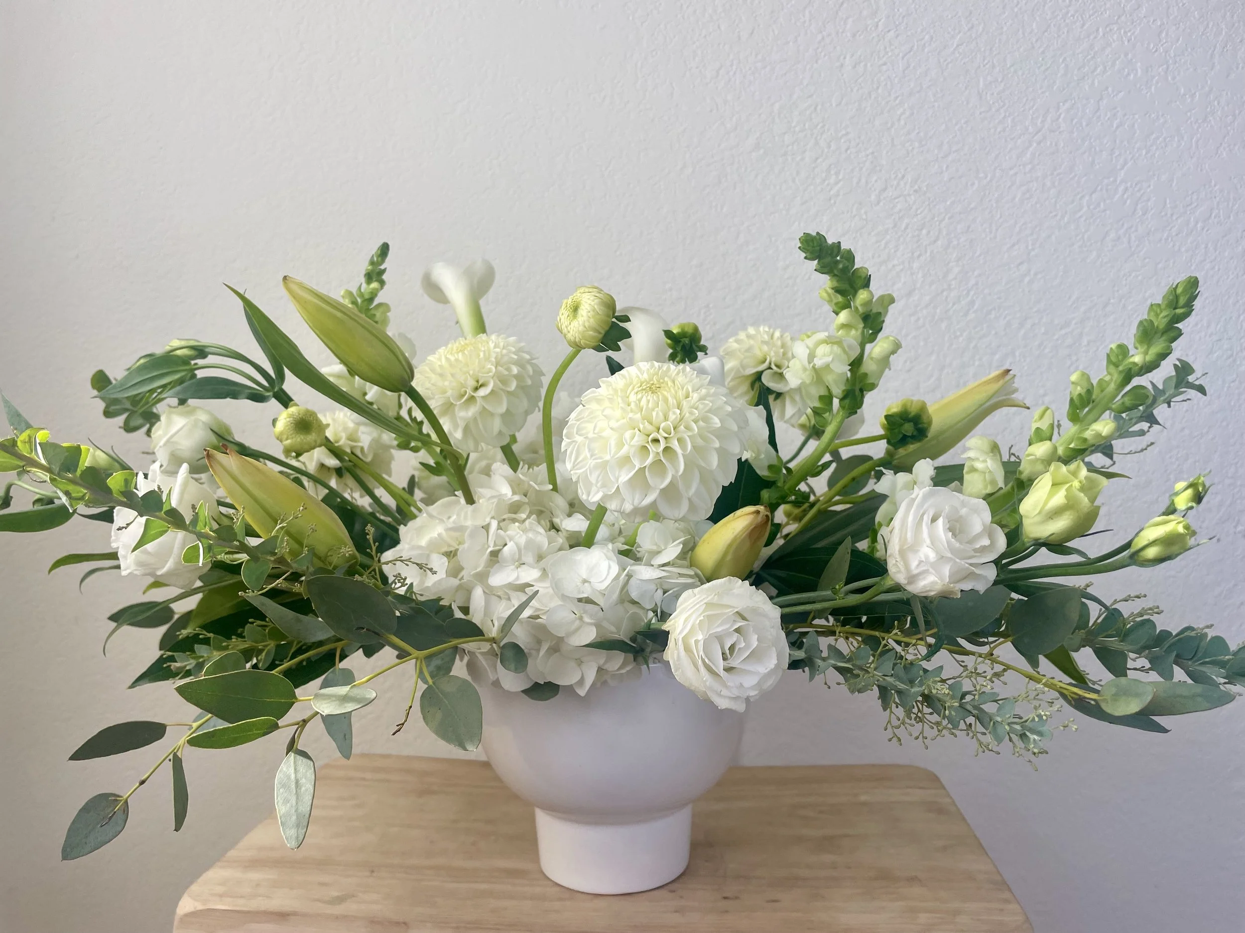 beautiful whimsical arrangement with extending arms and neutral colors