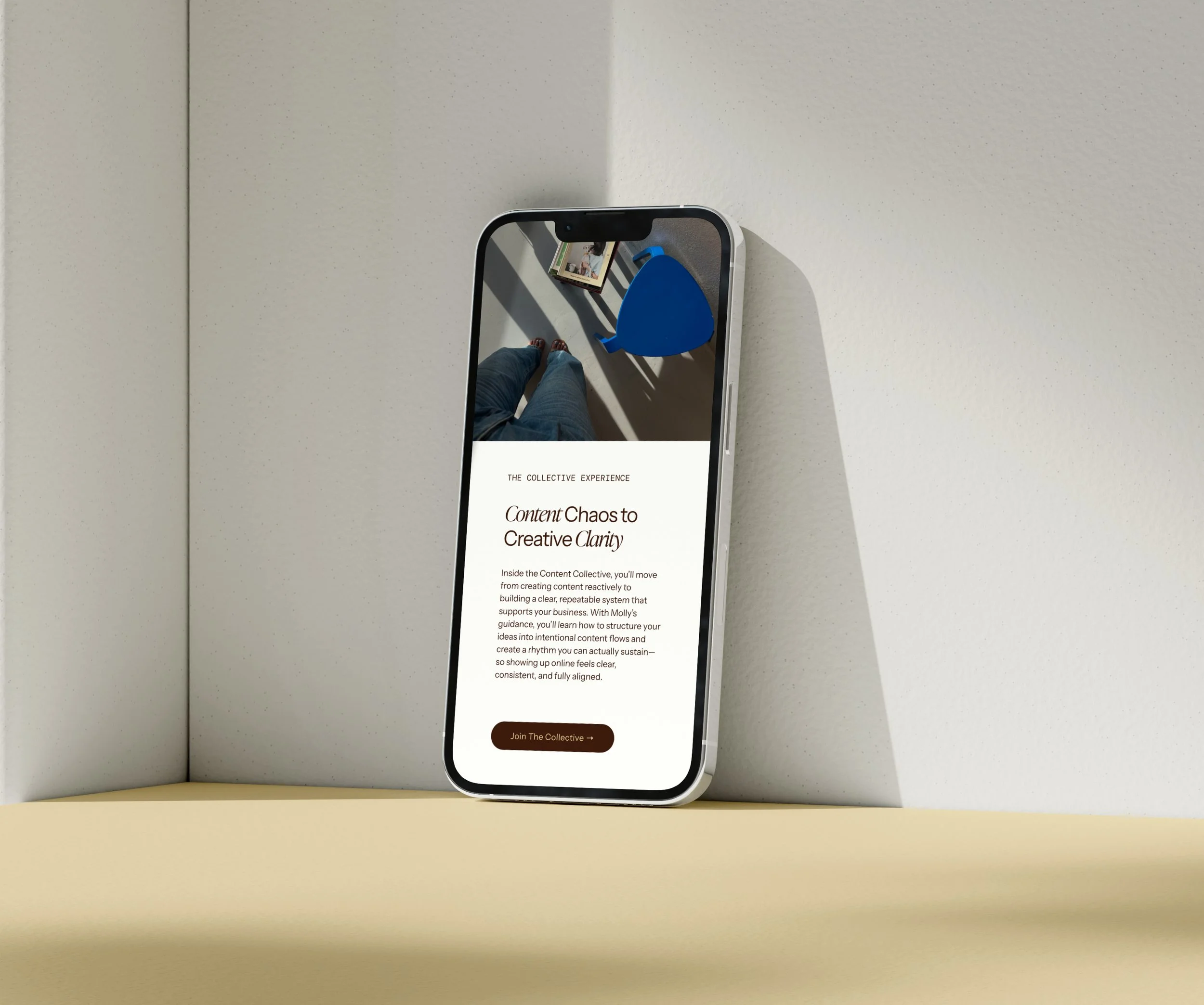 A smartphone displays a webpage for holistic, intentional, and conscious digital content creators using a premium Squarespace template from Heythere Studio.