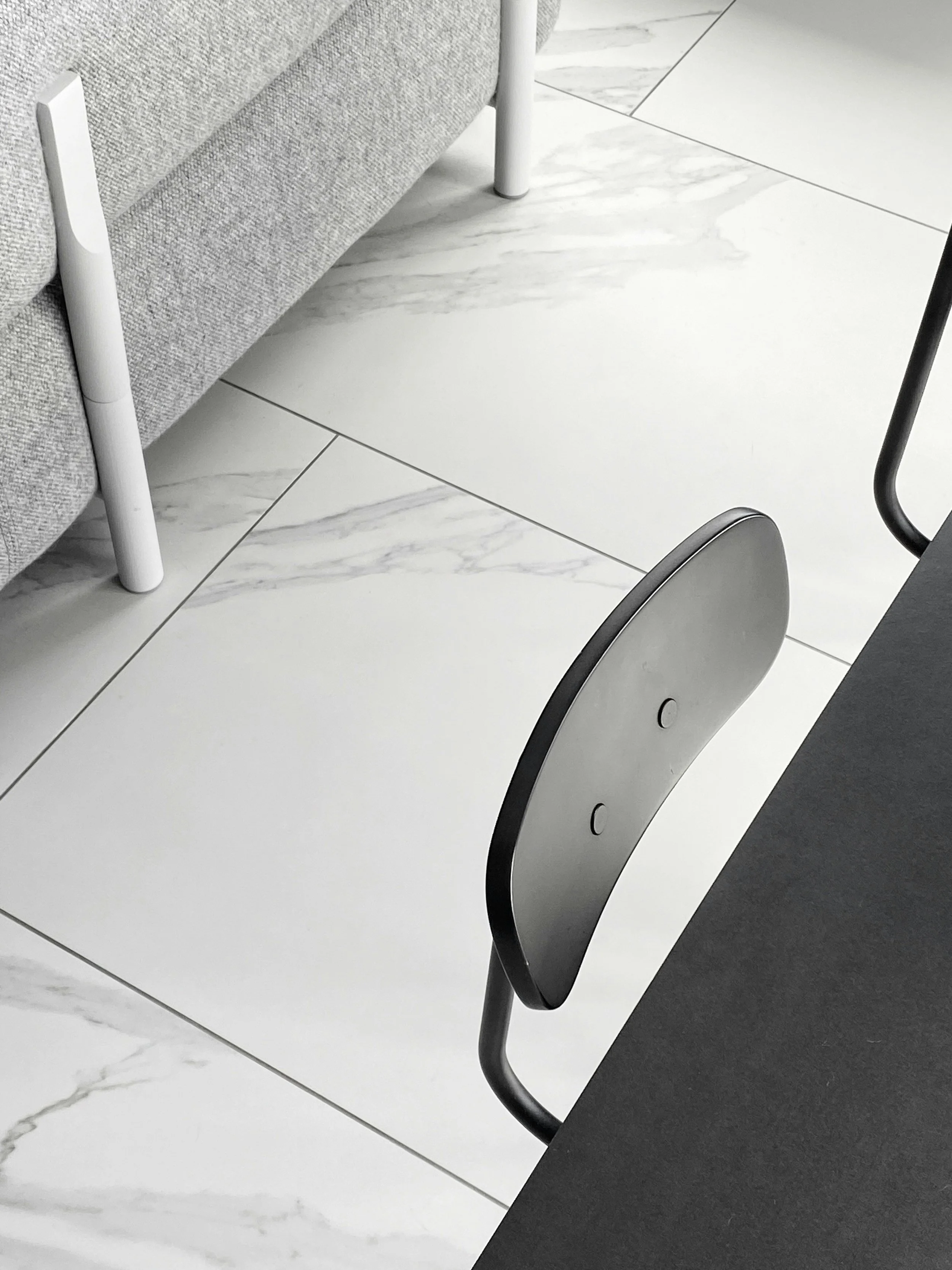 Interior tile flooring with white marble tile and gray grout