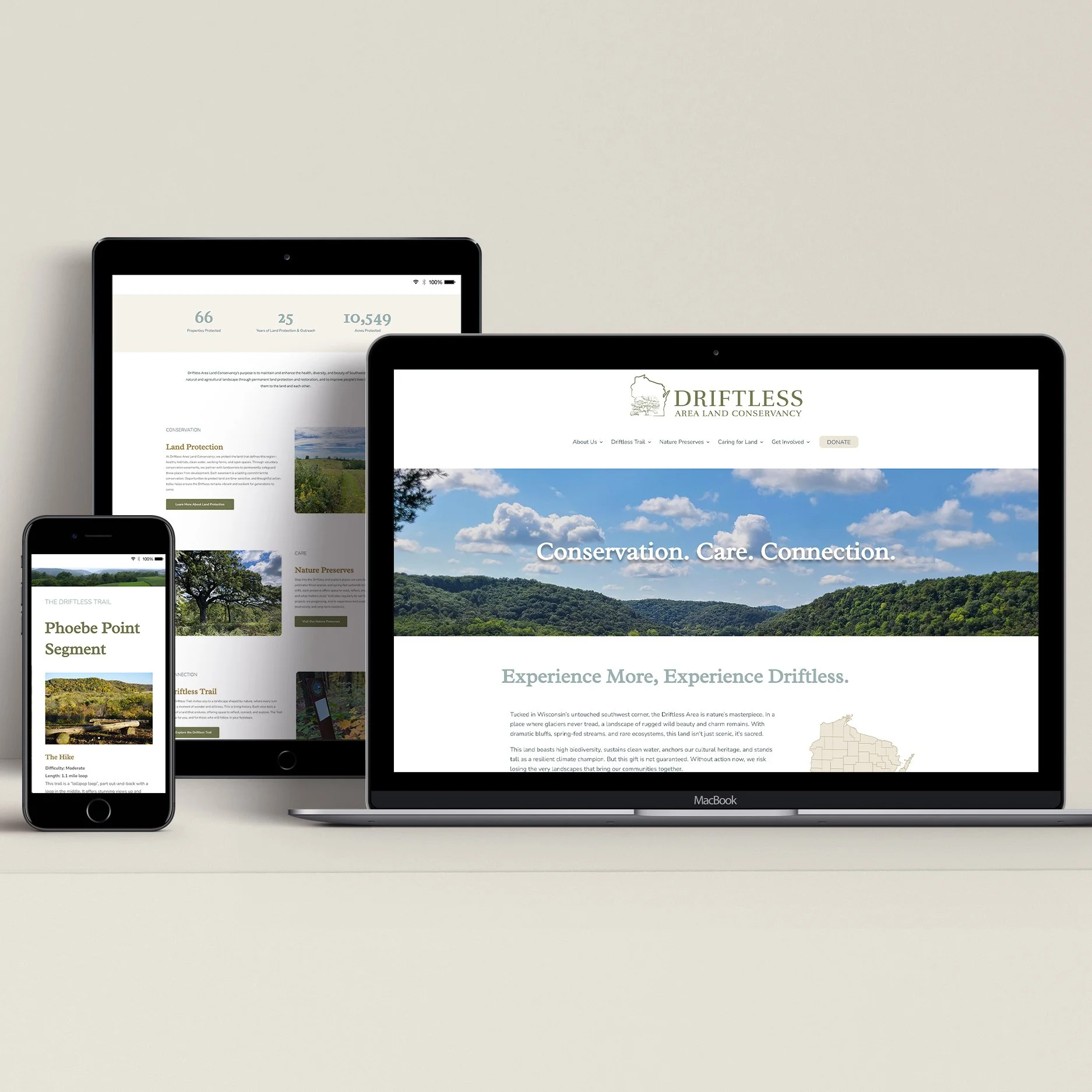 Multiple electronic devices displaying a website for Drifless Area Land Conservancy, featuring a scenic landscape with trees and hills, and text about conservation and connection.