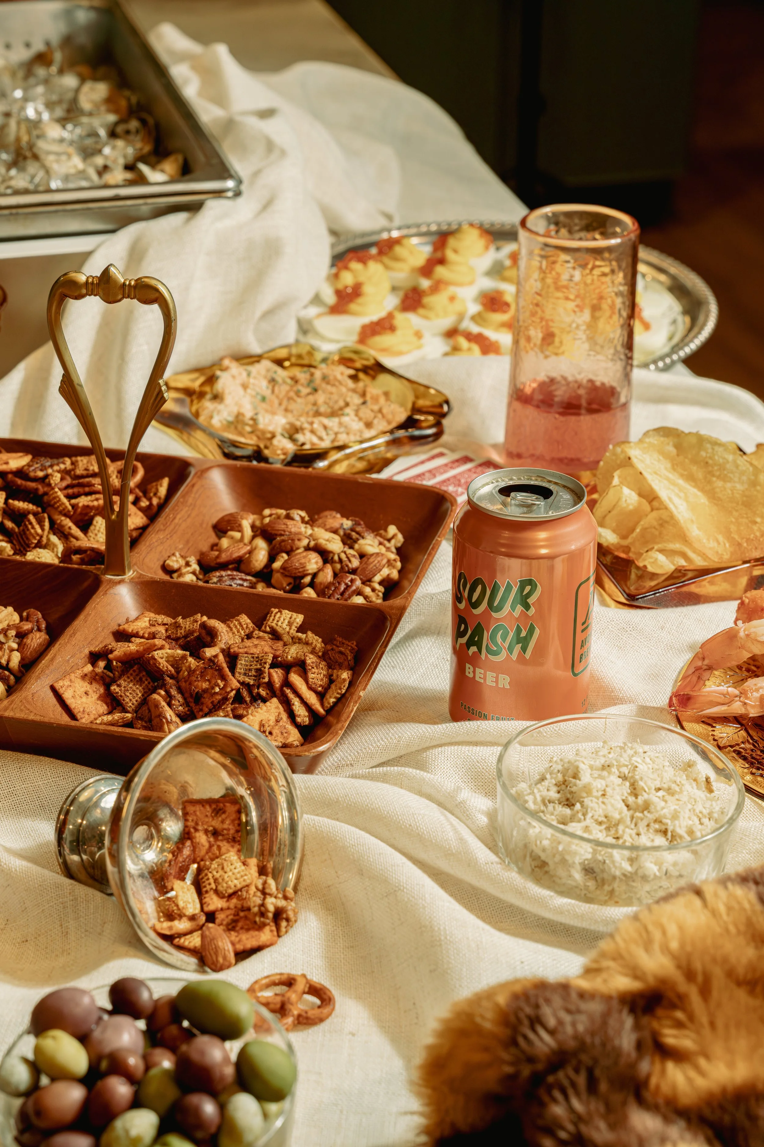 The Last Supper - linen table cloth, chex mix, craft beer, olives, trout dip, deviled eggs & vibes
