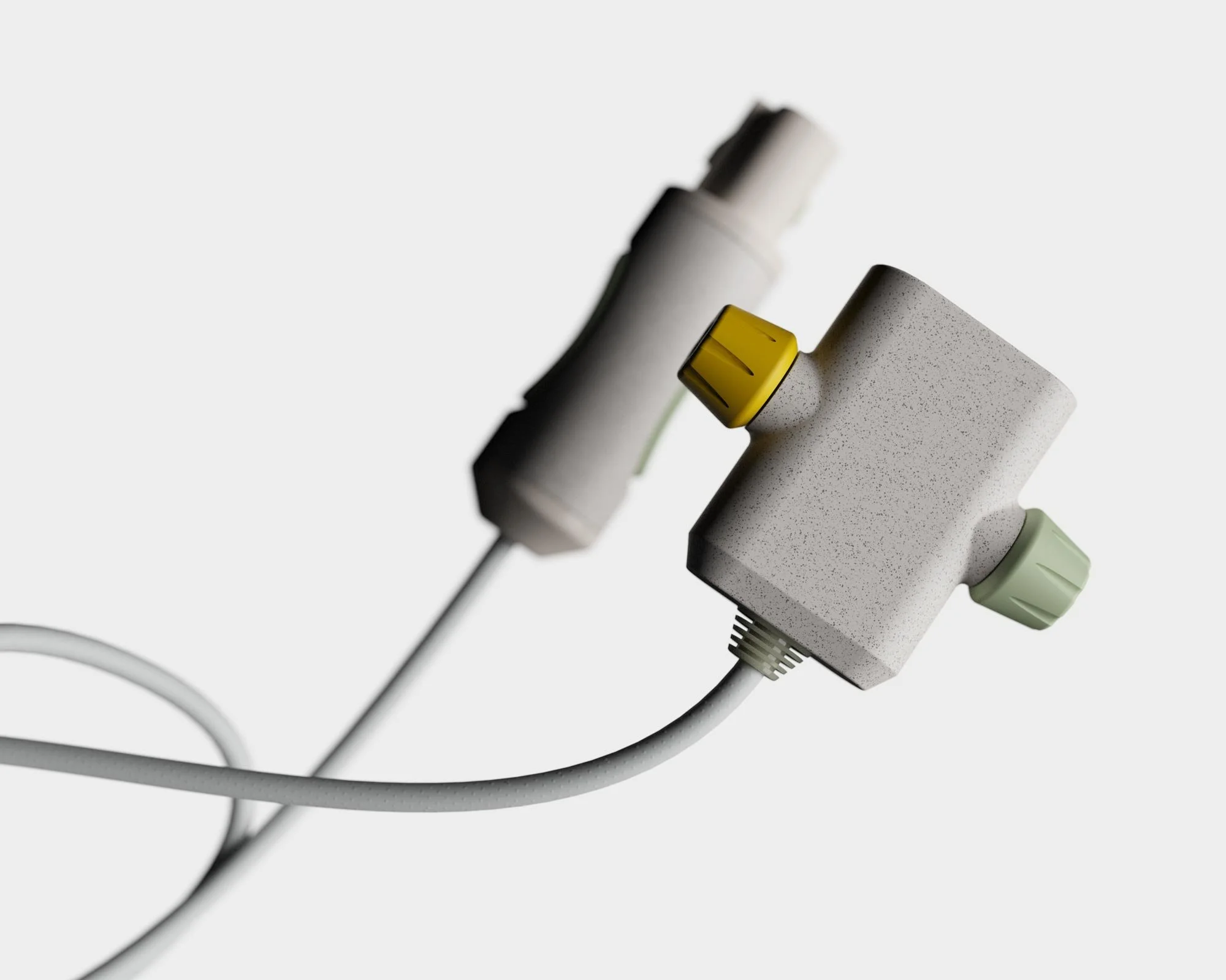 Close-up of medical or laboratory tubing with textured and colored connectors on a neutral background.