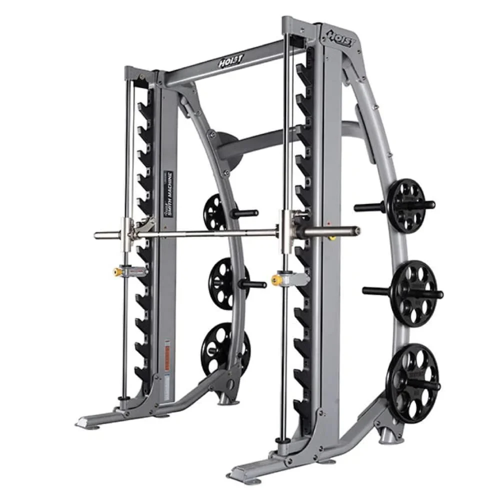 A multi-purpose gym machine with weight plates, a barbell, and various attachments for strength training.