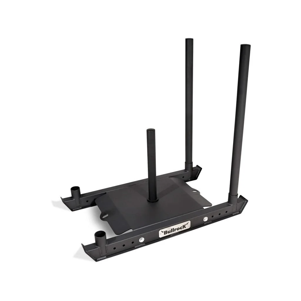 Black flat platform with four vertical poles, used for exercises, labeled 'Bullock'