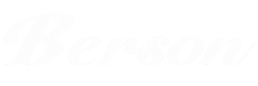 The word 'Berserk' written in white cursive font with black ink splatters on the text.