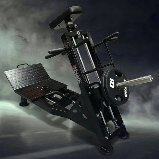 Black exercise rowing machine with a seat, footplates, and handles, set against a dark cloudy background.