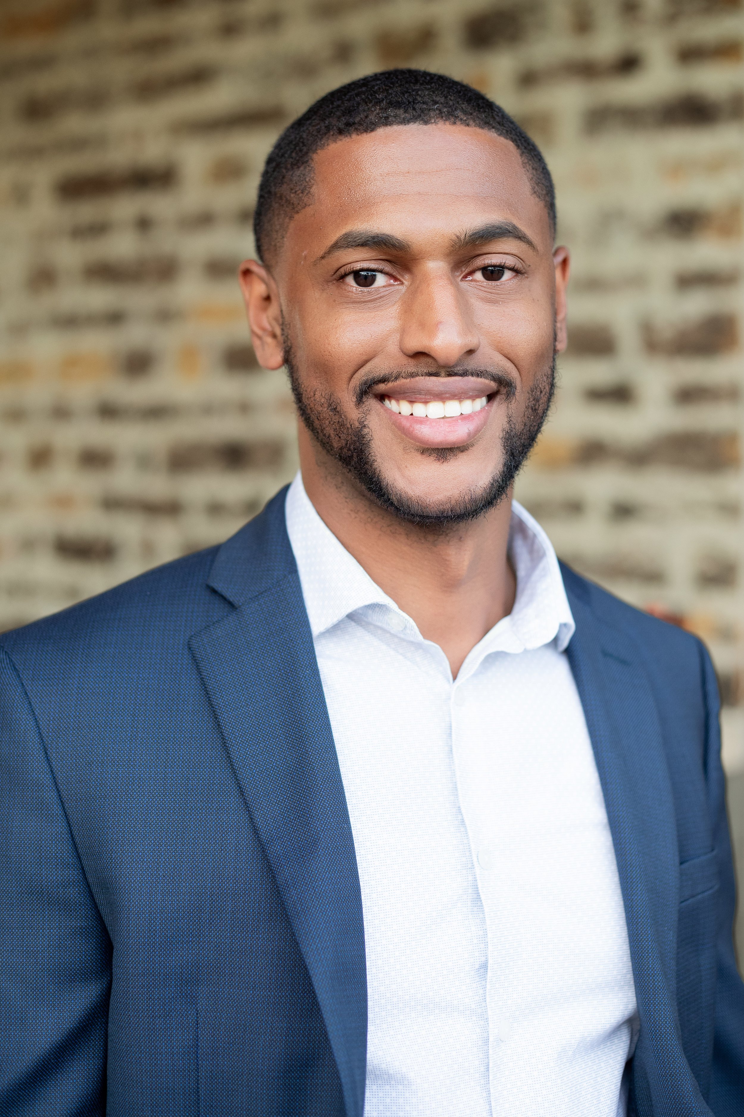 Professional business headshot featuring a confident male in a suit with a clean, modern look. High-end headshot photography by Dominic Alvarez Photography serving Houston, Katy, and surrounding areas across Southeast Texas.