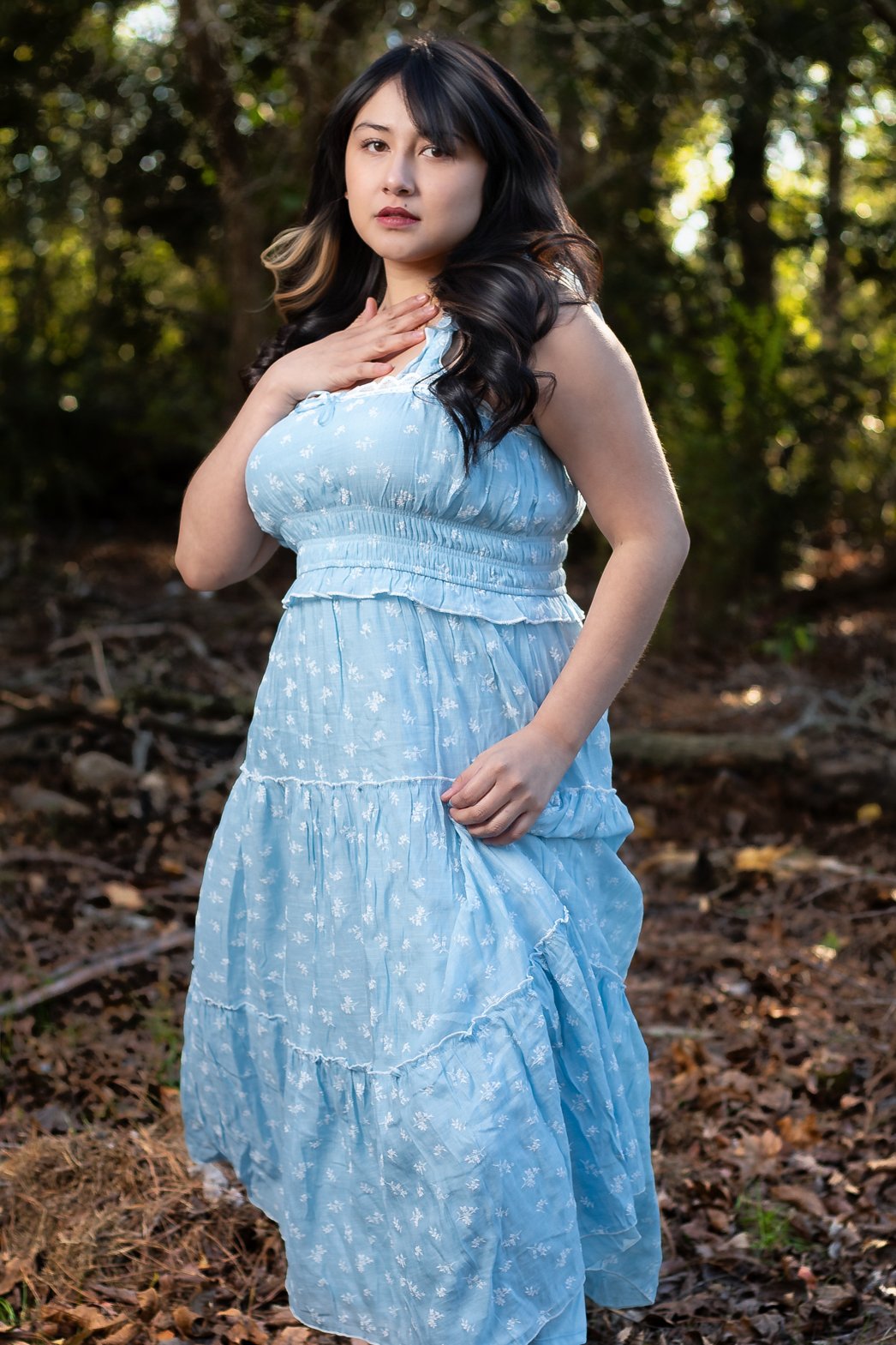 Katy high school senior photographer capturing an outdoor senior session with soft natural light and a woodland backdrop.