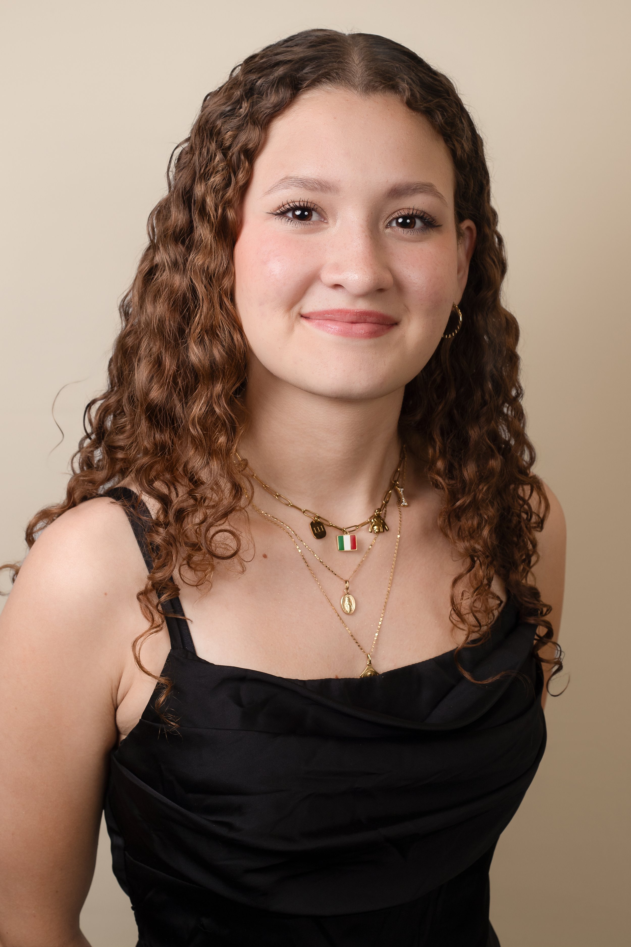 High School Senior Headshot. Clean background, Picture of teen girl with a light smile in Katy, TX